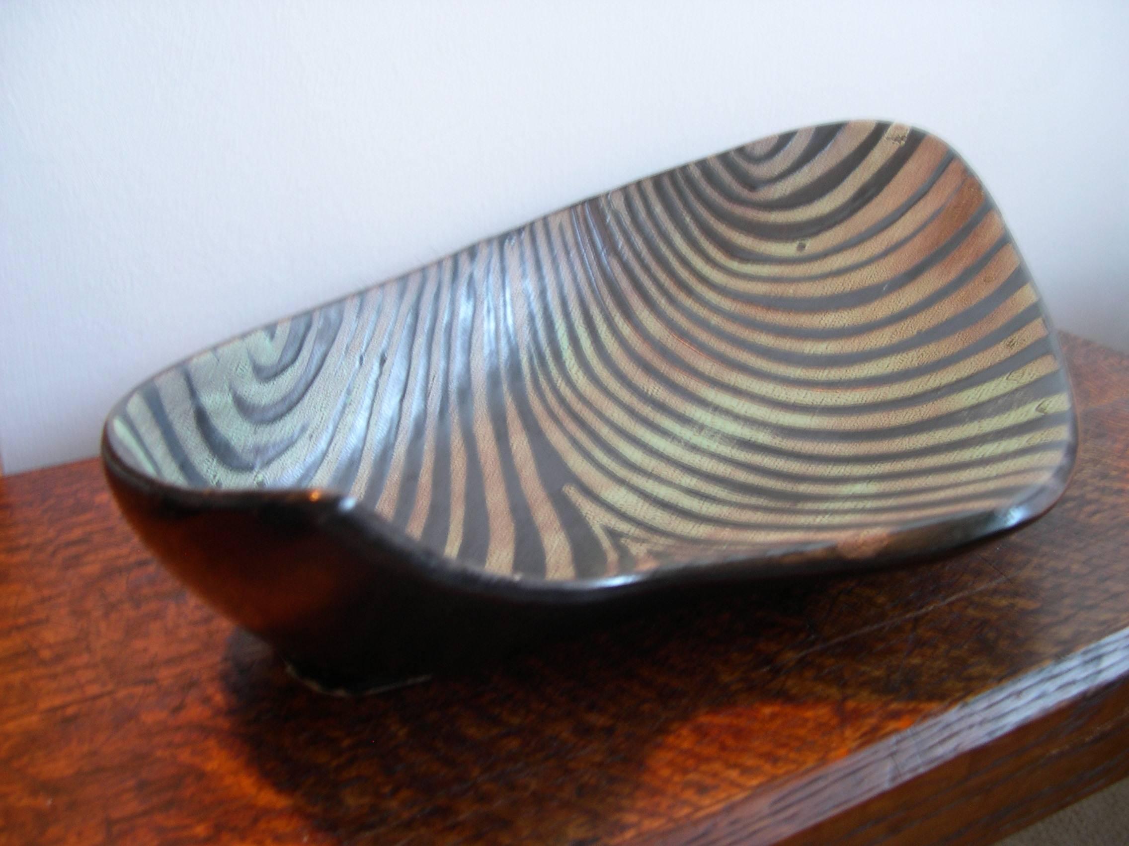Rare large free-form dish by Roger Capron with wave effect painted glazes. Signature to base. This purely abstract decoration all-over the piece is unusual amongst Capron's oeuvre and dates to the last period in which he produced the wax resist