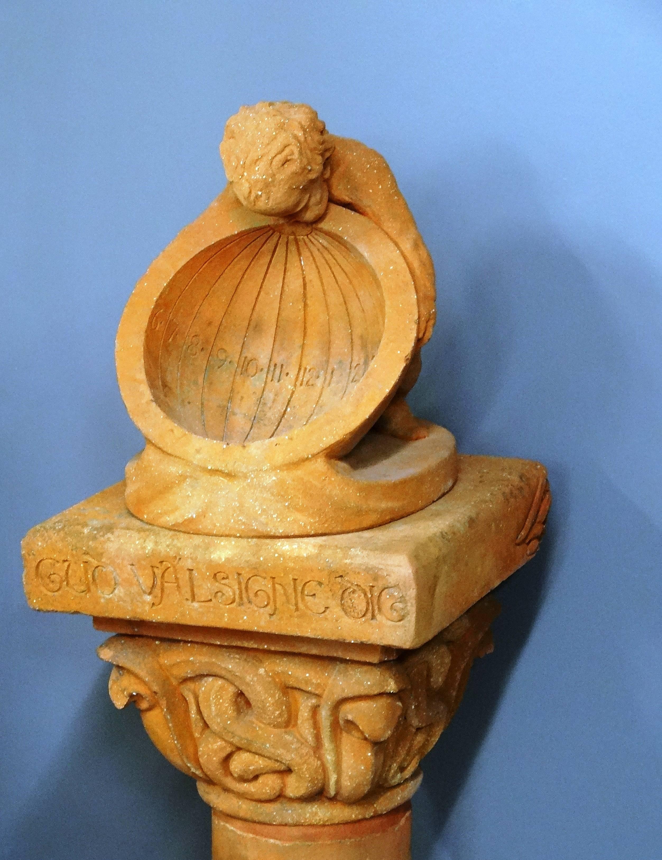 A rare terracotta Arts & Crafts Compton Potters Arts guild sundial; circa 1900, known as the “Cobra Sun Dial”; illustrated in their catalogues at the time; this version surmounted with the separate Compton cherub sundial. The cobra sun dial was