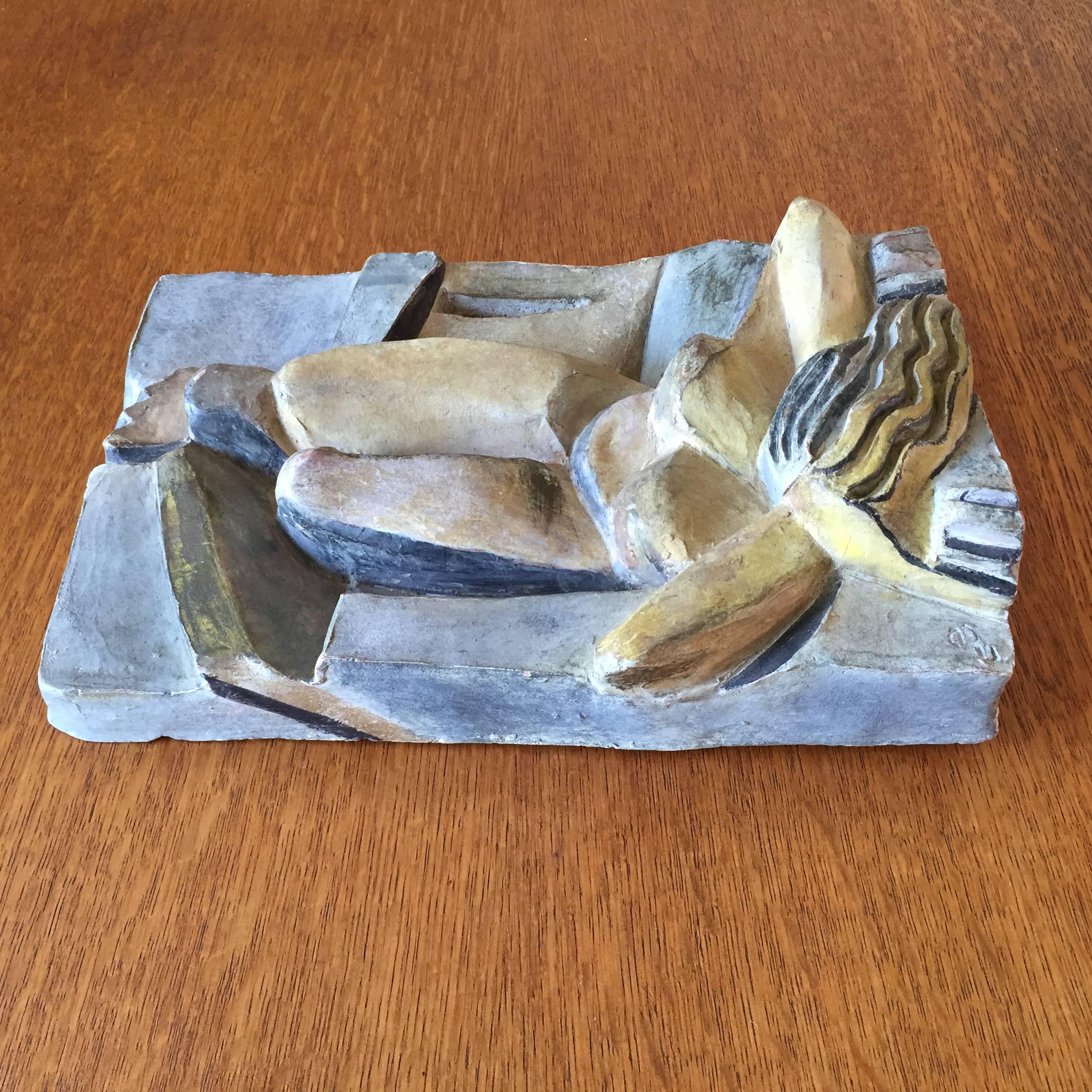 Very interesting signed rectangular cubist terracotta relief of a reclining woman with hand-painted finish (unglazed) the monogram looks like "GB" or "CB. The work has the handling of a very competent artist and demands more research,
