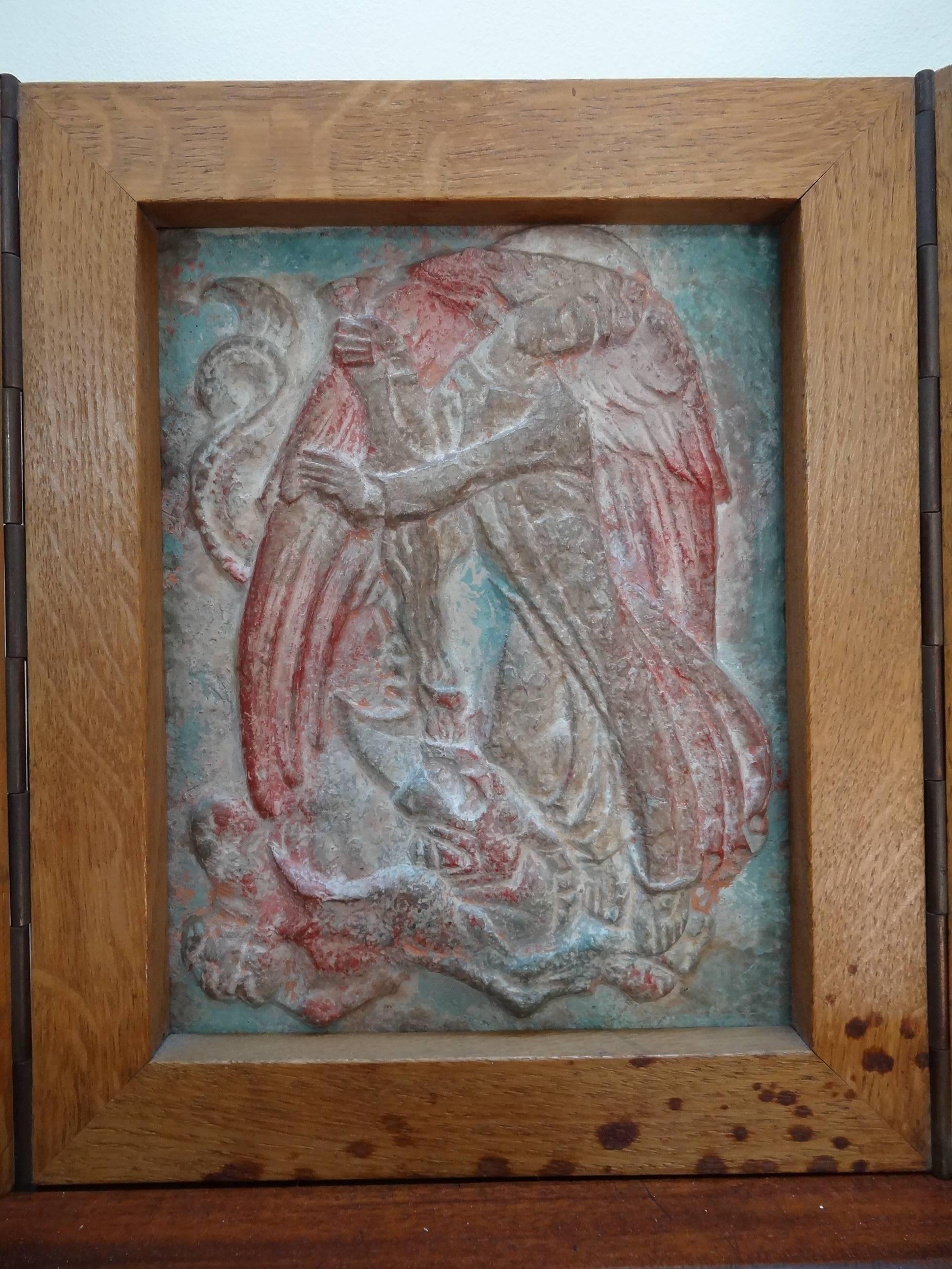 A unique and unusual superb relief carved and painted stone plaque depicting the archangel St Michael and the Dragon, mounted in it`s original thick solid oak cabinet triptych frame, with Latin and French incised inscriptions and dedicated to Mary