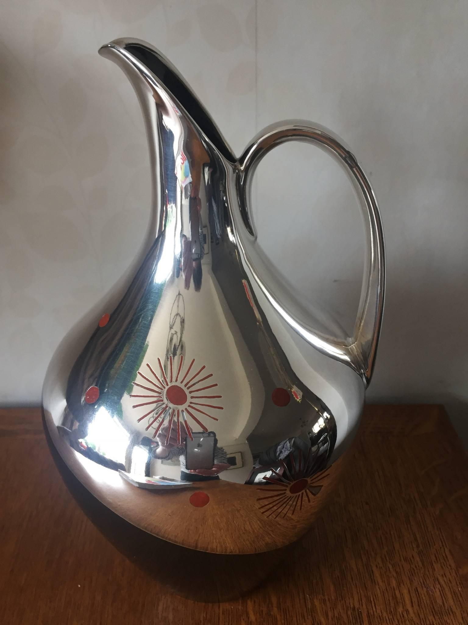 Striking fine quality porcelain jug with silver overlay and red enamel abstract details. The design attributed to Friedrich Spahr. Marks to the handle and base including 1000 for pure silver. Dates to circa 1950. Light wear to one small area