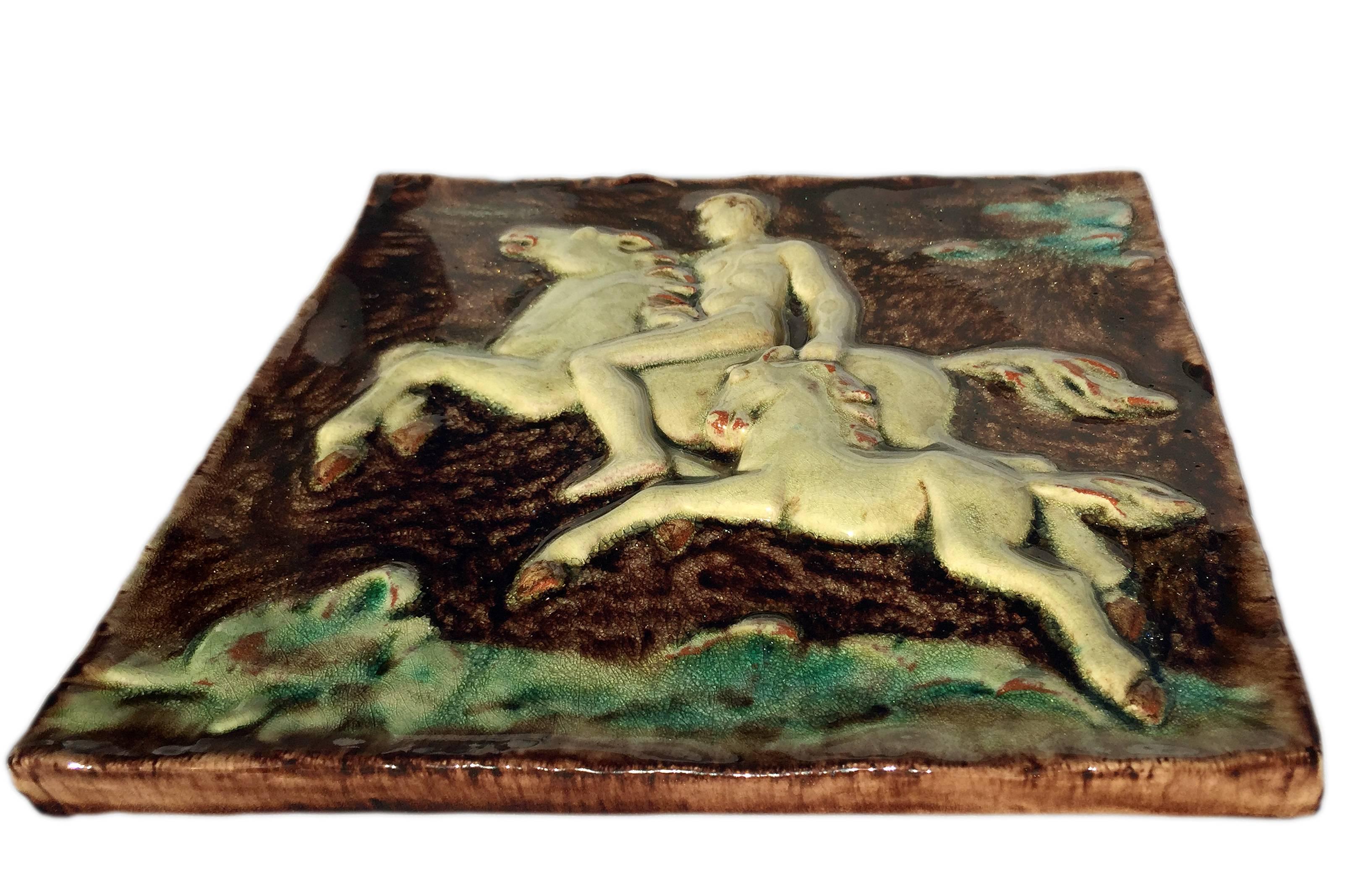 Rare and important wall tile panel relief depicting a nude rider, a horse and a foal in cream, terracotta, brown and green high glossy glaze by Hugo Ruf, 1937-1951.
Marked and signed on the backside Karlsruhe Majolica, serial number 4714.
The tile