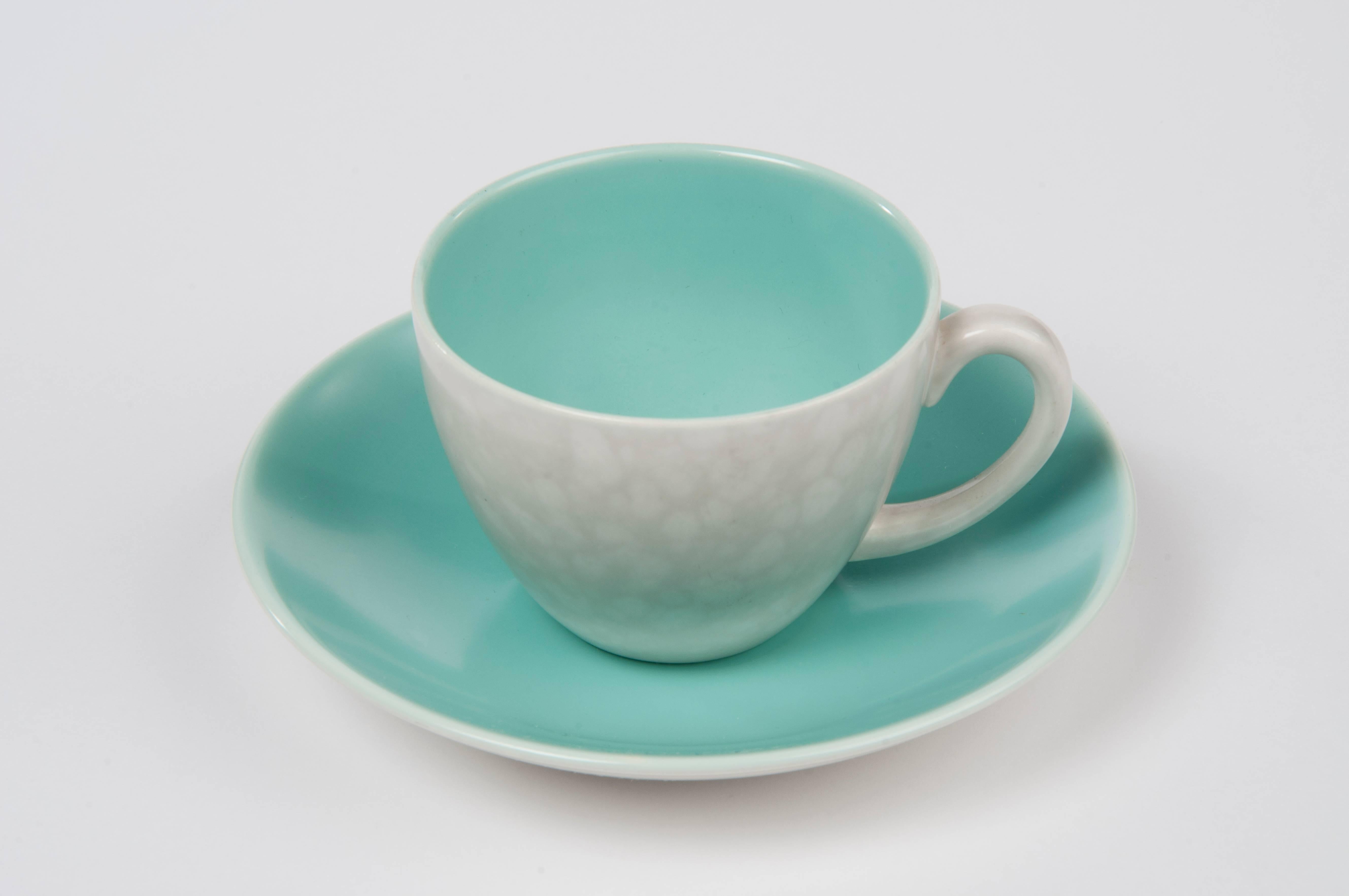 Graceful and elegant 1950s coffee and dinner service by Poole England in silky bright turquoise and spotted grey. Designed by Guy Sydenham and Alfred Read. The surface has a silky touch and shimmer. The grey resembles of mother-of-pearl.
FREE