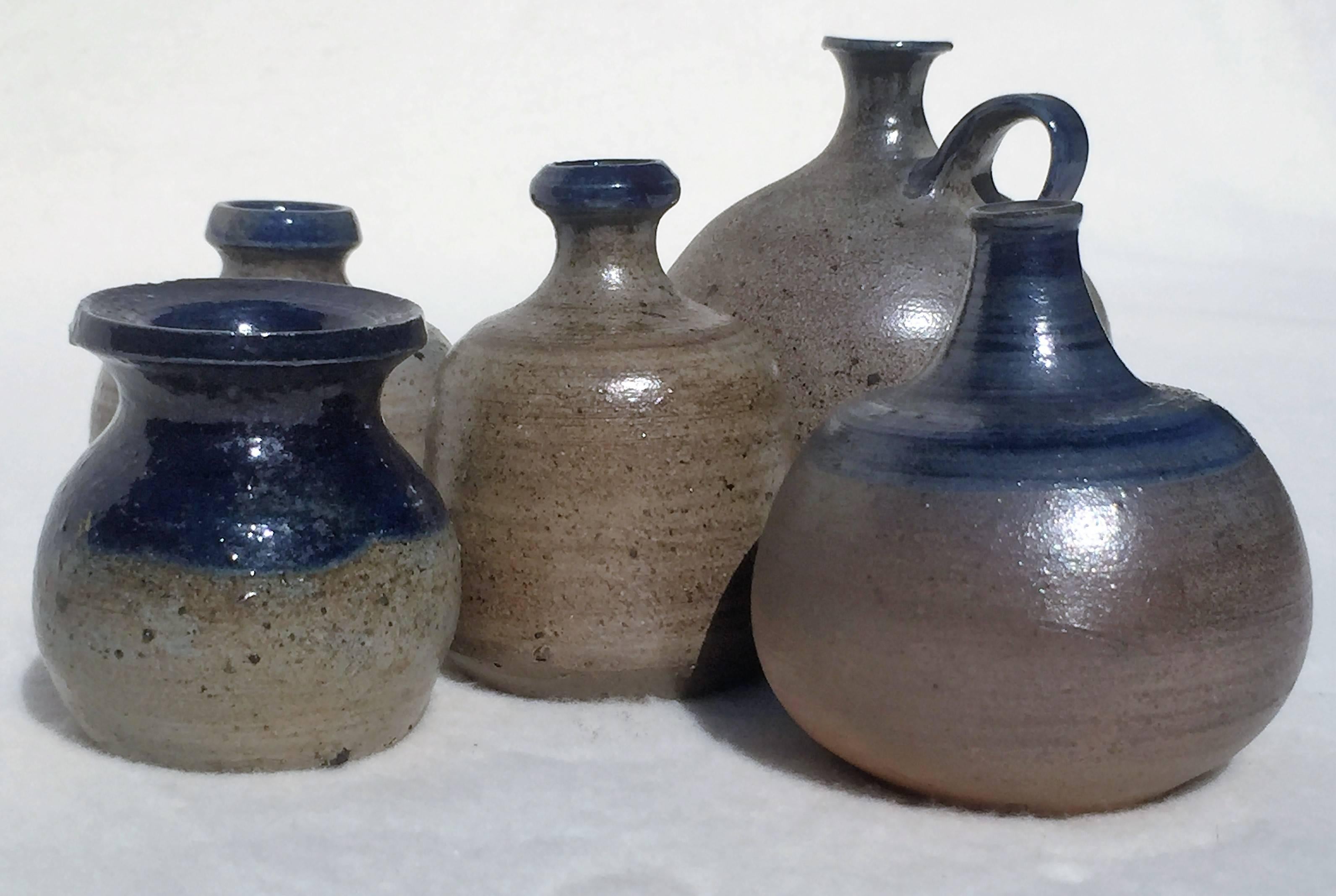 A set of five unique turned ceramical miniature vases, grey and blue salt glaze with a mother-of-pearl shimmer. By Lilo Grinzoff-Assenmacher, Germany, 1960s. Salt glazed ceramics is an extremely hard material, burned at very high temperatures.
The