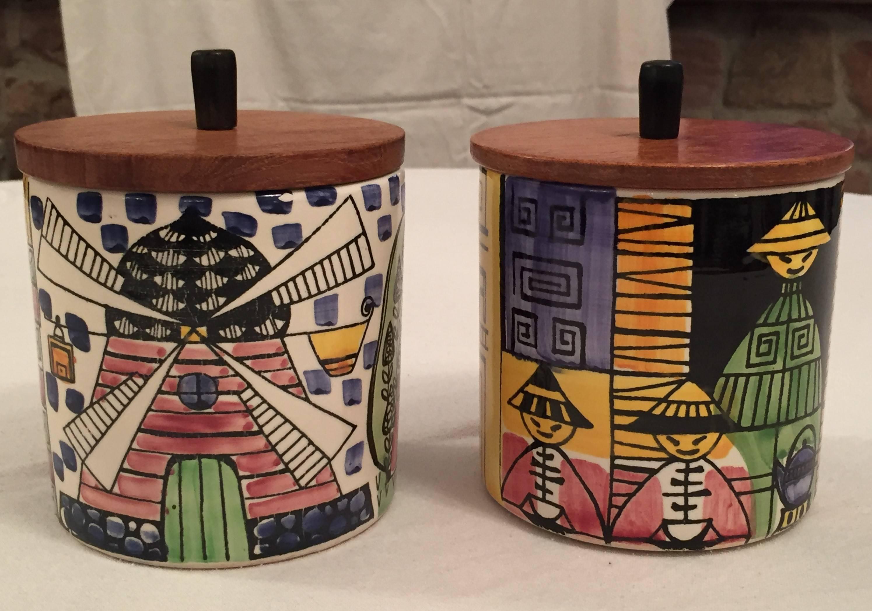 A pair of Scandinavian tea and coffee ceramical jars with teakwood lid, Jie Gantofta, Sweden, 1960s. They are colorfully hand decorated by Anita Nylund and signed underneath. 
Worldwide insured shipping is included in the price.