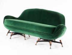 Smooth green sofa, marked IPE; particular feet in beechwood; Bologna, Italy 1963