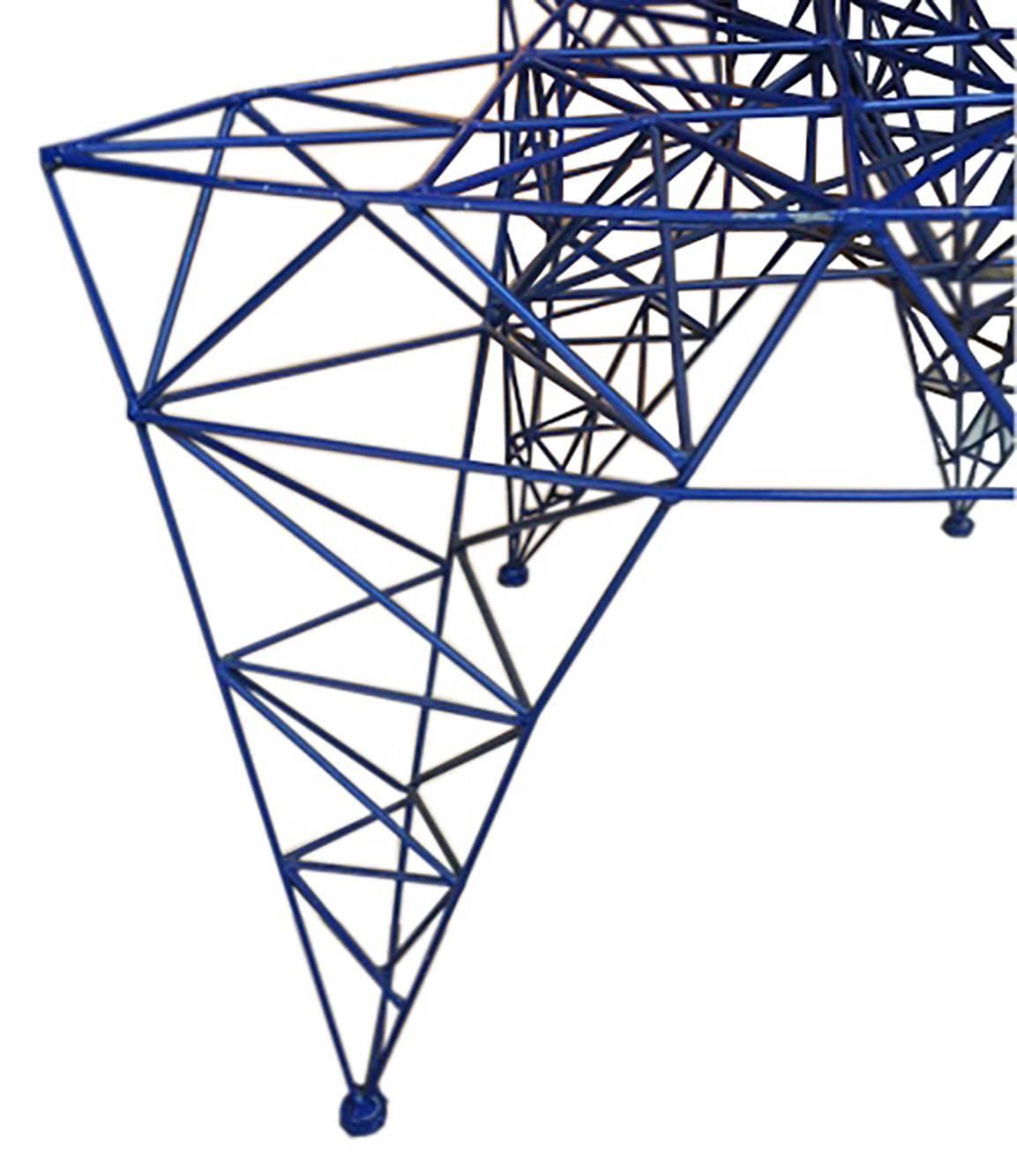 Steel wire, natural aluminum, black felt feet pads. Design by Tom Dixon, 1992.
 Made in Italy by Cappellini.
 The Pylon chair features steel wire, lacquered in blue natural aluminum.