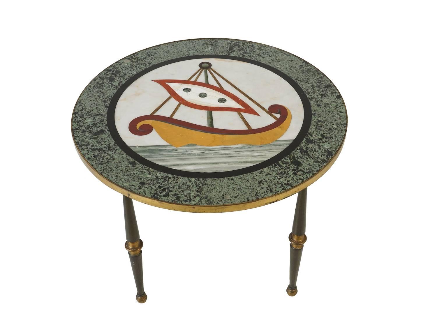 Italian side table with figurative marble top from the 1960s. The top is great craftsmanship and for the 1960s a very modern design, the base is in black metal legs combined with brass details. As the figurative inlay with marble is all handwork