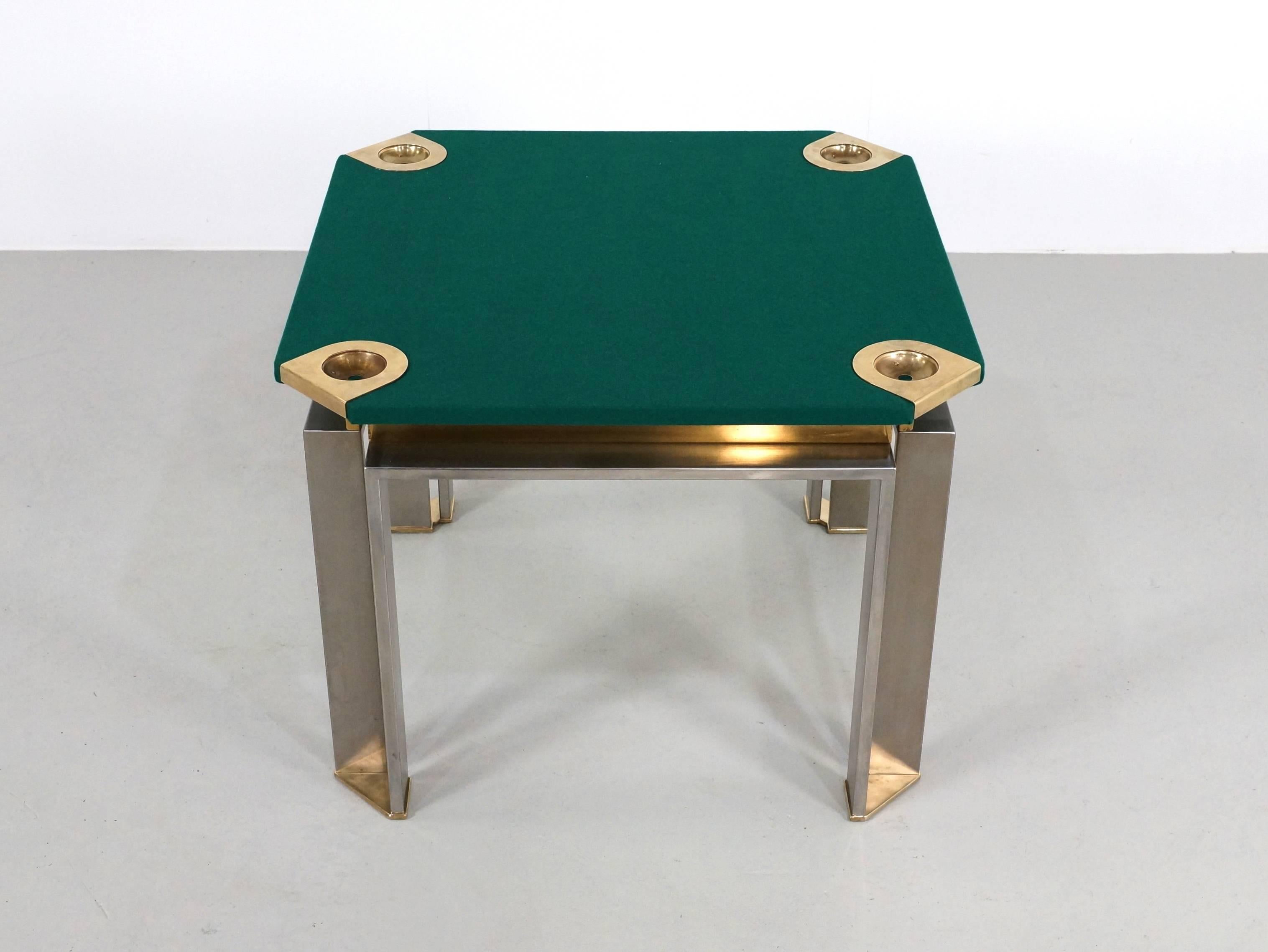Beautiful play table by Romeo Rega in brass and stainless steel with green felt top and brass corners to put in the money. Nice and exceptional piece in very good condition. The felted top has been replaced, so its imperfect condition.