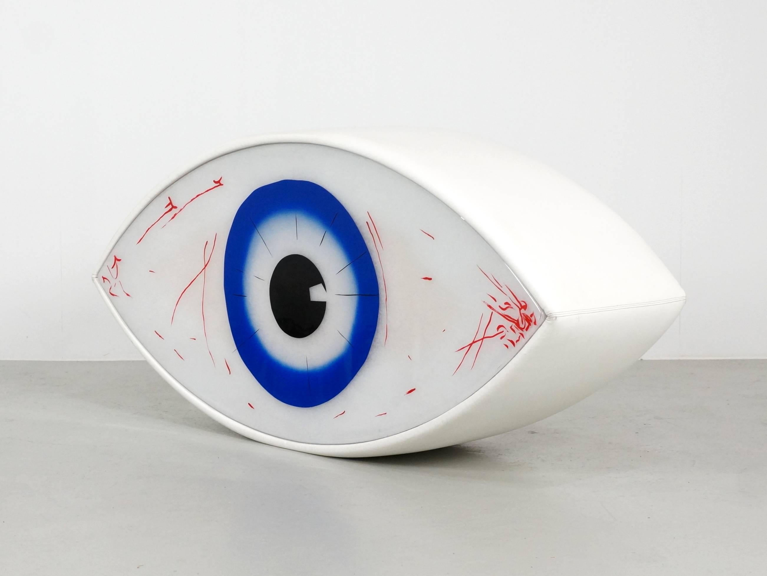Beautiful sculpture seat/table designed by Man Ray and Dino Gavina in 1971, this Limited edition is quite rare to find. The silkscreen printed eye is methacrylate, with a wooden frame covered with leatherette. This is one out from the ultramobile