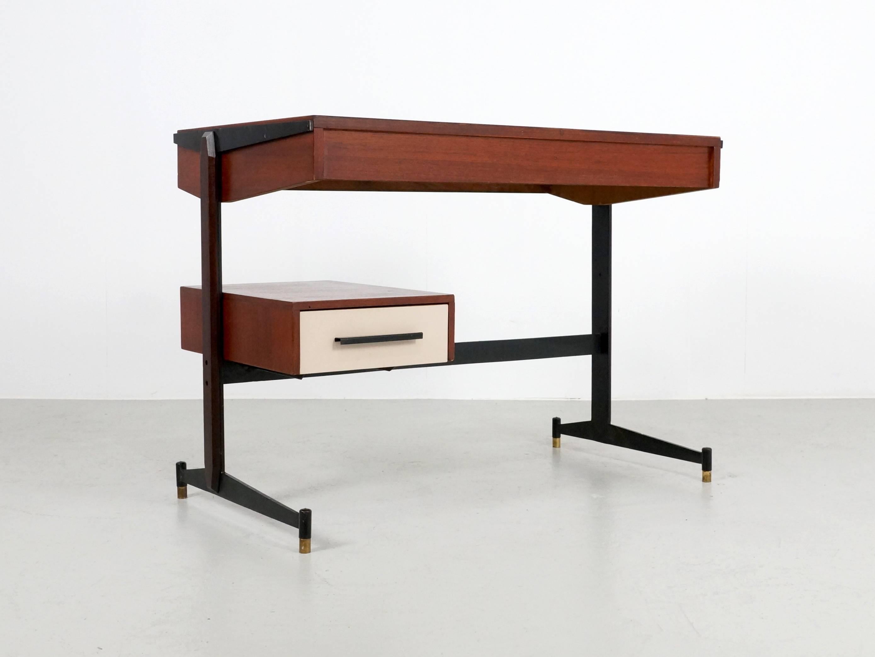 Great small teak desk with a small drawer and laminated top. 
This Italian piece is very nice to use as a telephone or computer desk or even as small study desk. The small size makes it fit everywhere. The fine metal base with on the side pieces of