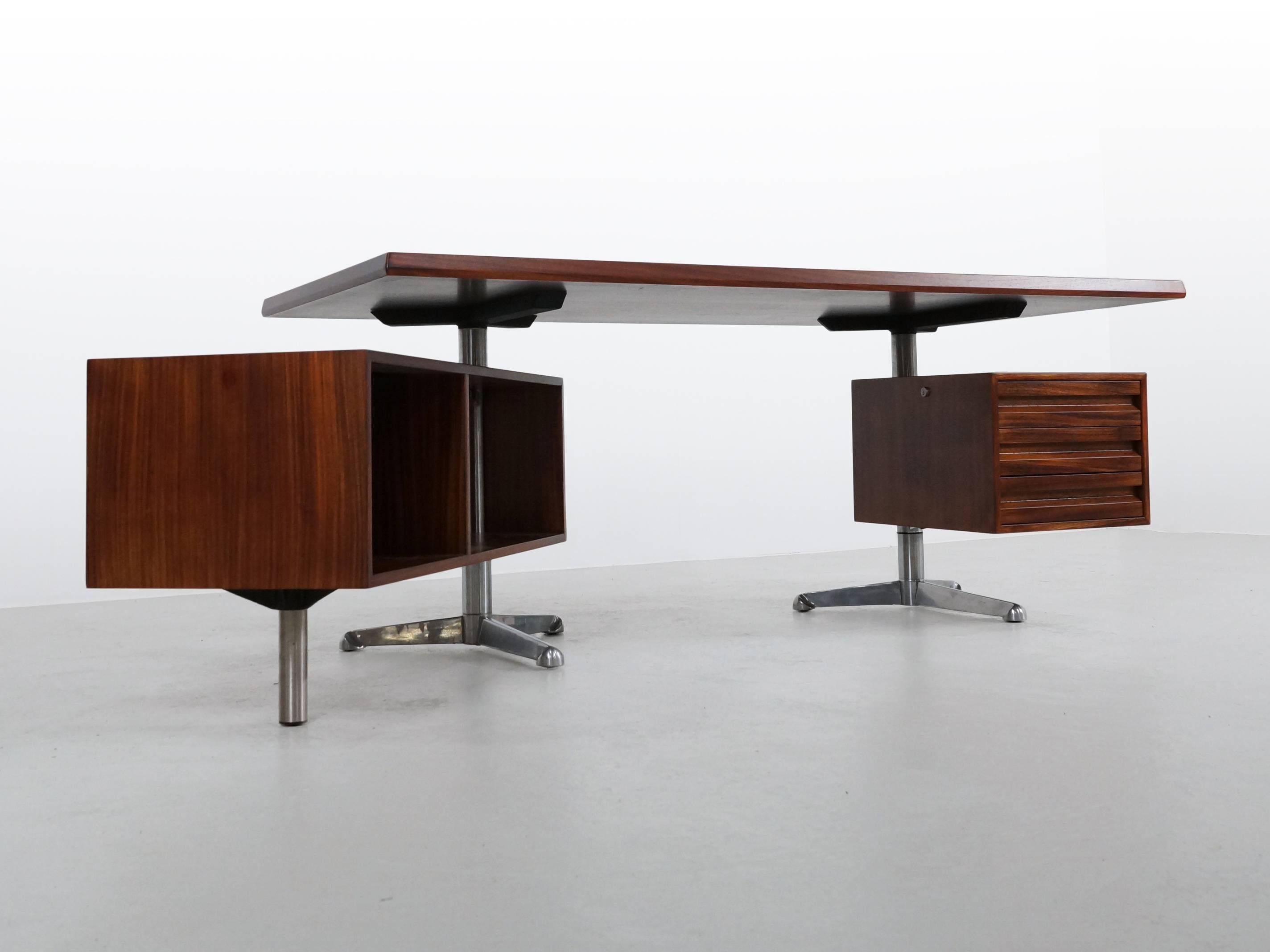 Beautiful rosewood Tecno Desk by Osvaldo Borsani. This desk has one drawer cabinet on the right side, and one large cabinet with storage on the left side. The left cabinet has been customized by Tecno as a small open drink cabinet with a glass