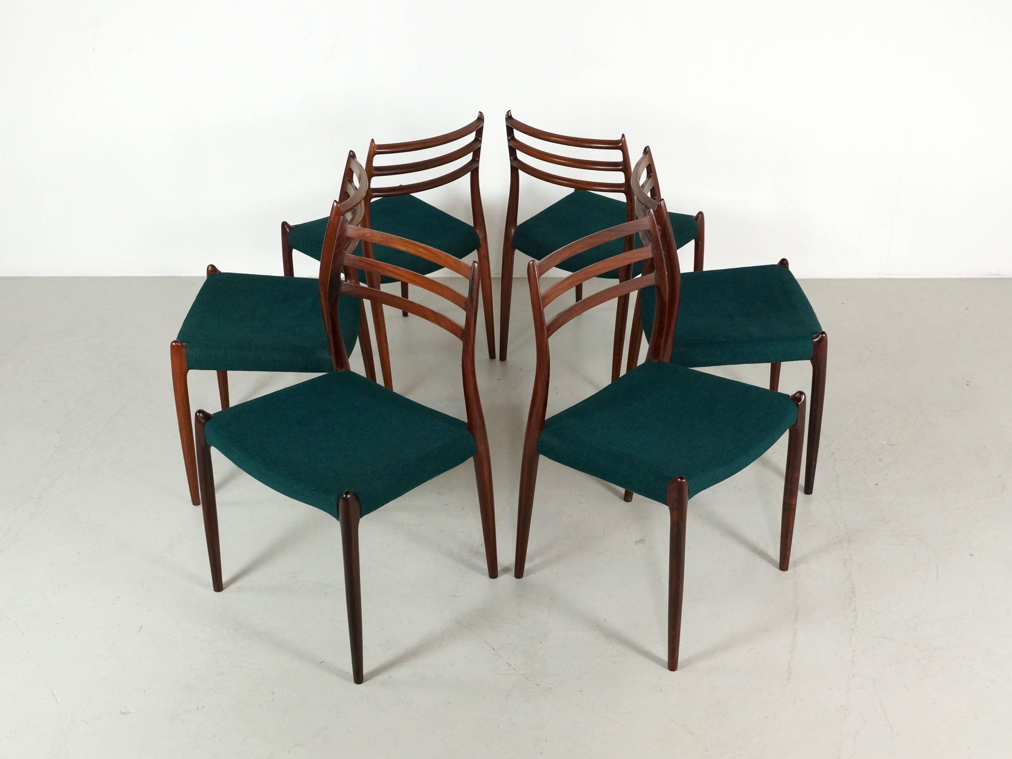 Great set of six rosewood Møller chairs designed by Niels Otto Moller for J.L. Møller. The chairs have their original reupholster with green fabric and are in very good condition. Beautiful set and on request there is also a rectangular or round