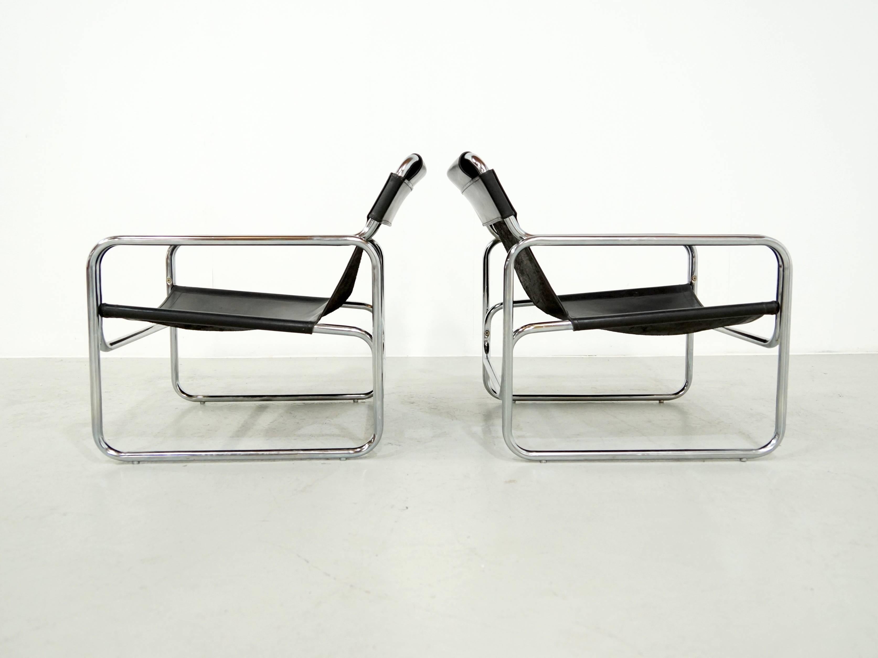 A very nice pair of black leather lounge chairs, Model Attico, designed by Antonello Mosca, Italy, 1970. Chrome tubular frames and thick black leather seats. Very good condition. Literature: Modern Furniture Designs 1950-1980, Klaus-Jurgen Sembach,