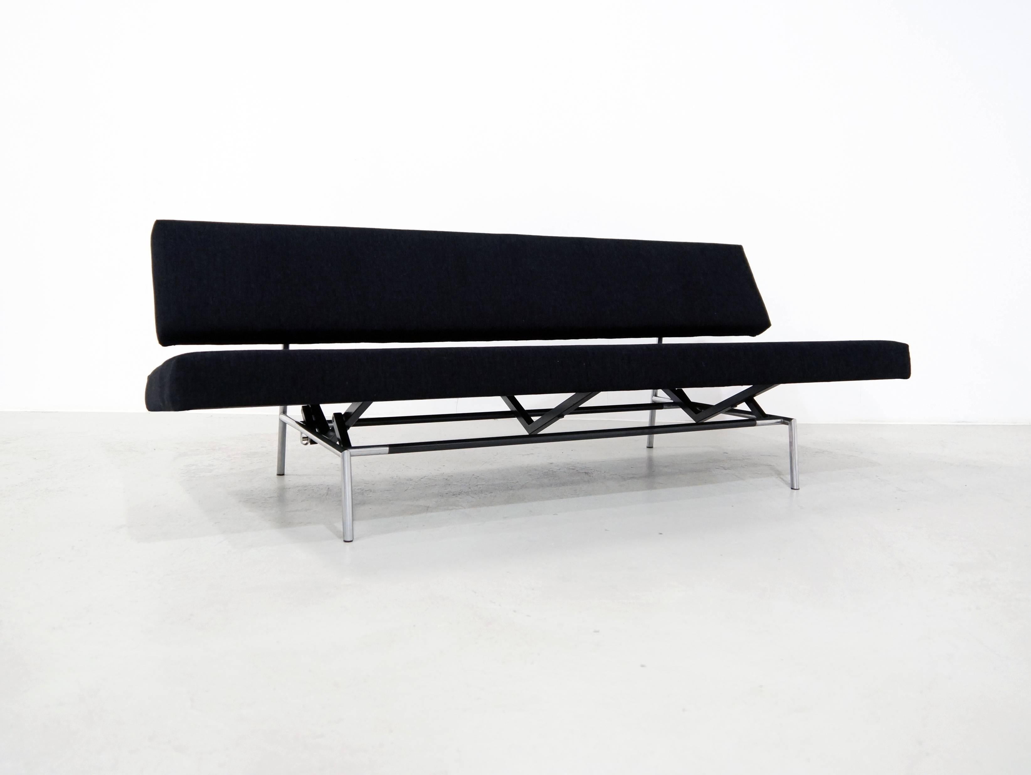 In 1958 Martin Visser designed this Minimalistic Rectangular daybed - Sofa for Spectrum, Bergeijk. 
Spectrum is a Dutch manufacturer of mainly chairs, sofas and some cabinets. This sofa is an early edition with metal frame and stainless steel Frame