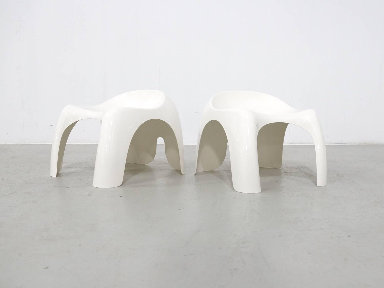 Set of two white stackable molded ABS resin stools. This is the larger version; a smaller children's model, Efebino, was also produced by Artemide. The stool are marked on the bottom, made by Artemide, designed by Stacy Dukes in 1960s.
       