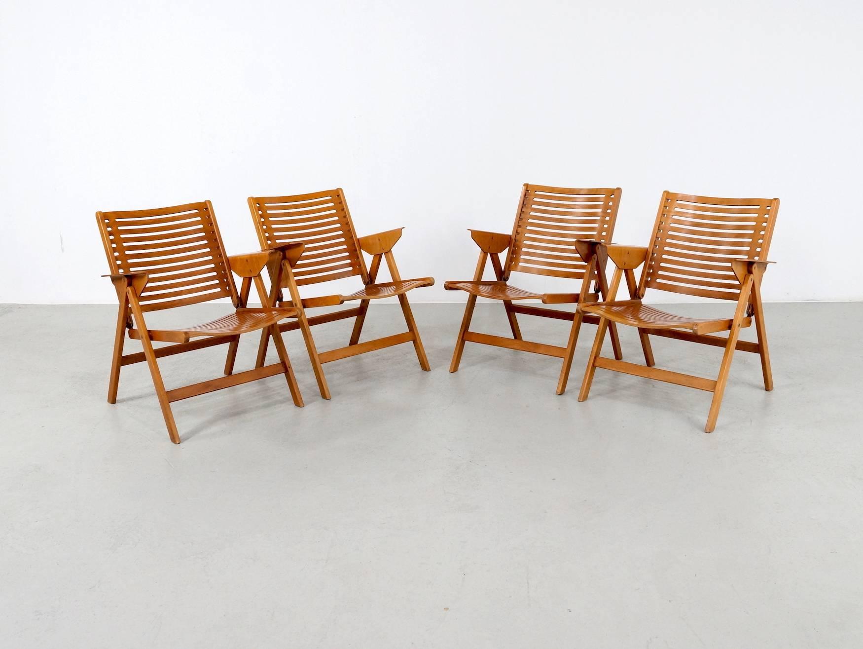 This set of four foldable easy chairs model Rex, this chair is designed by Niko Kralj and manufactured by Stol in Slovenia. The chairs are made of plywood and beech and remain in a good original vintage condition.The Rex chair was designed in 1952