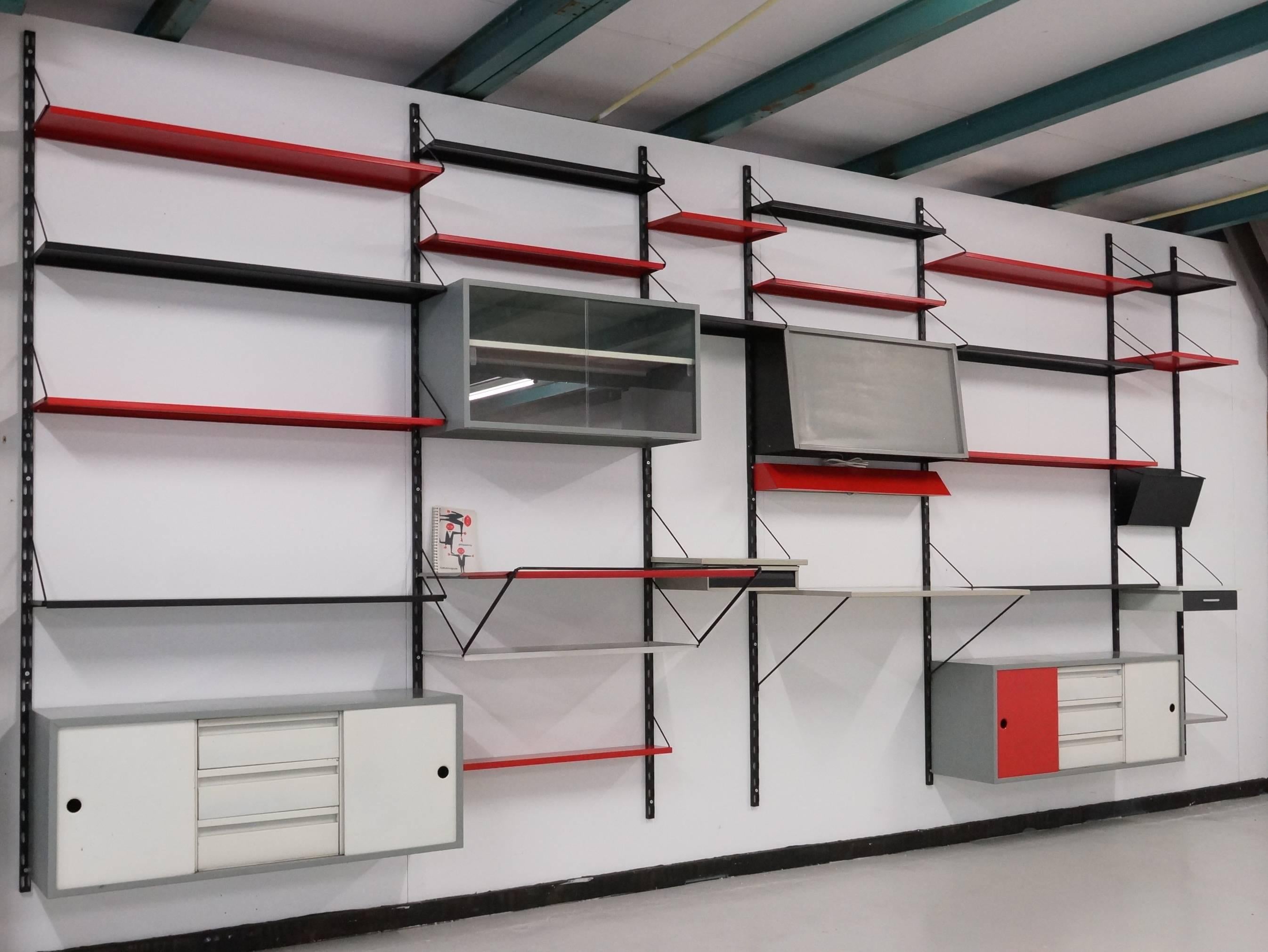 Beautiful extra large Pilastro modular wall system. In 1955 Tjerk Reijenga promoted his metal modular shelving system in Dutch interior magazine ''Goed Wonen'' the various possibilities of the system and the norm range of different product for the