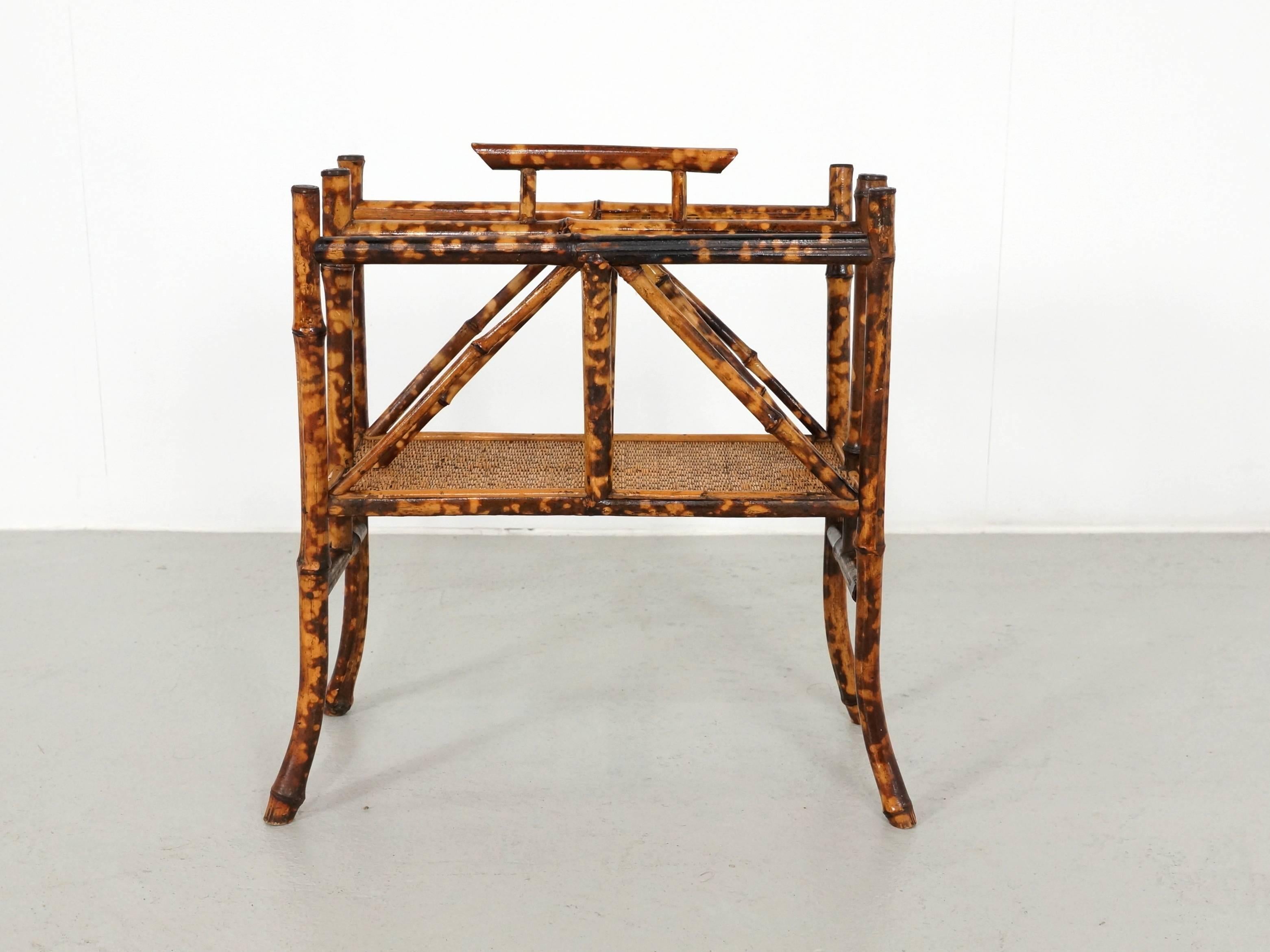 English tortoise pattern bamboo magazine rack dating from the end of the 19th century. In very Good condition with Rattan webbing. These magazine racks are very nice for Art Deco furnishing.