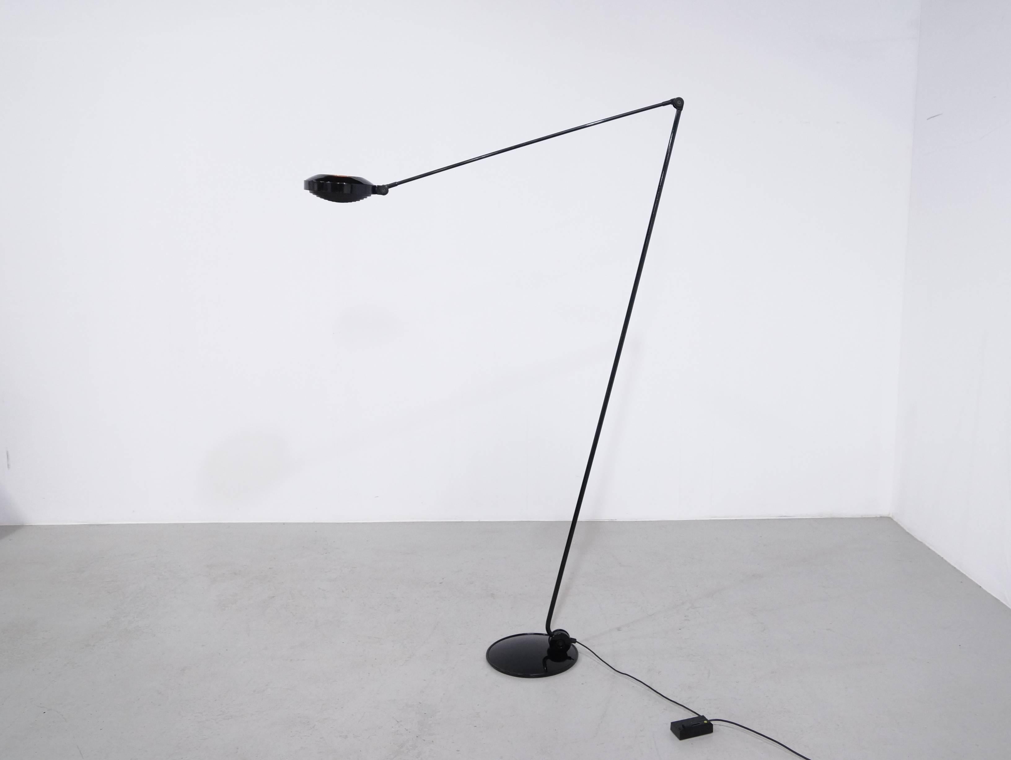 A first edition (1978 ) of the Minimalistic halogen floor lamp Elle 2 by Tommaso Cimini for Lumina. This floor lamp can be used for direct or diffused Lightning. Jointed long arms with an adjustable reflector and special grid for glare control.
This