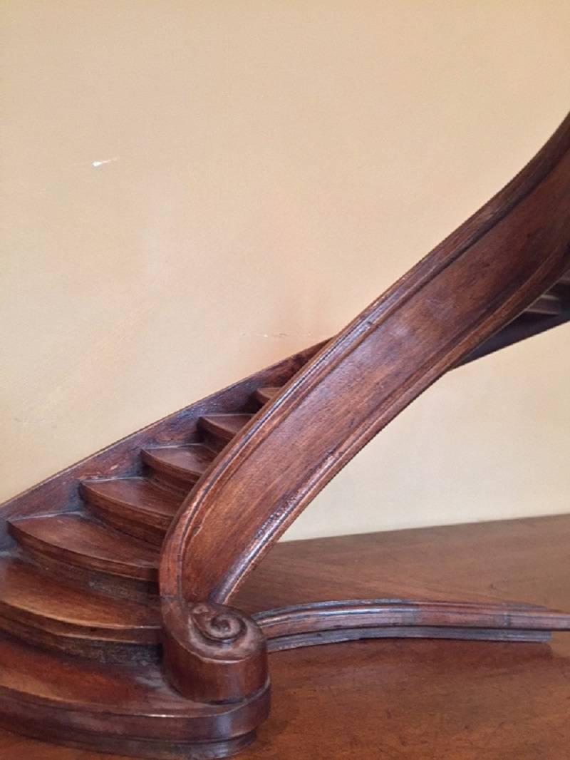 Elegant 19th century model of a staircase in walnut. The quality of this piece suggests that it was made as a master proof for the so called Compagnonnage or Carpenters Guild which was has roots going back to the Middleages and still exists today.