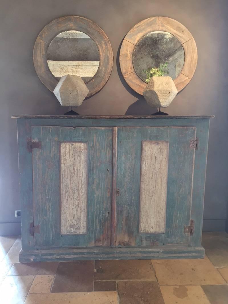 Charming Italian 17th century Buffet with original paint. The piece is made from large softwood boards and painted in an attractive bleu pallet. Its panneled doors have the original iron hinges and are accentuated in darker panneling. The whole