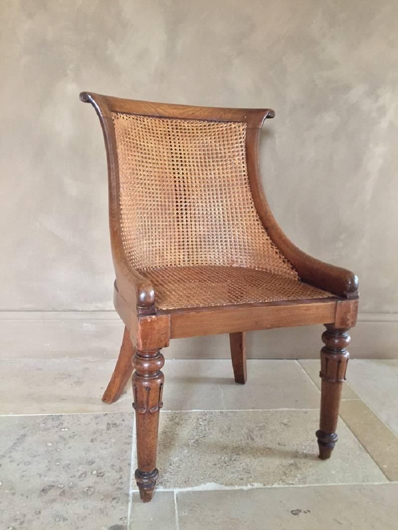 Elegant Gondole library chair with great lines and details. This Victorian English chair is of high quality and most likely comes from a prominent country or townhouse. Its design goes back to Greek and Roman furniture and was interpreted by