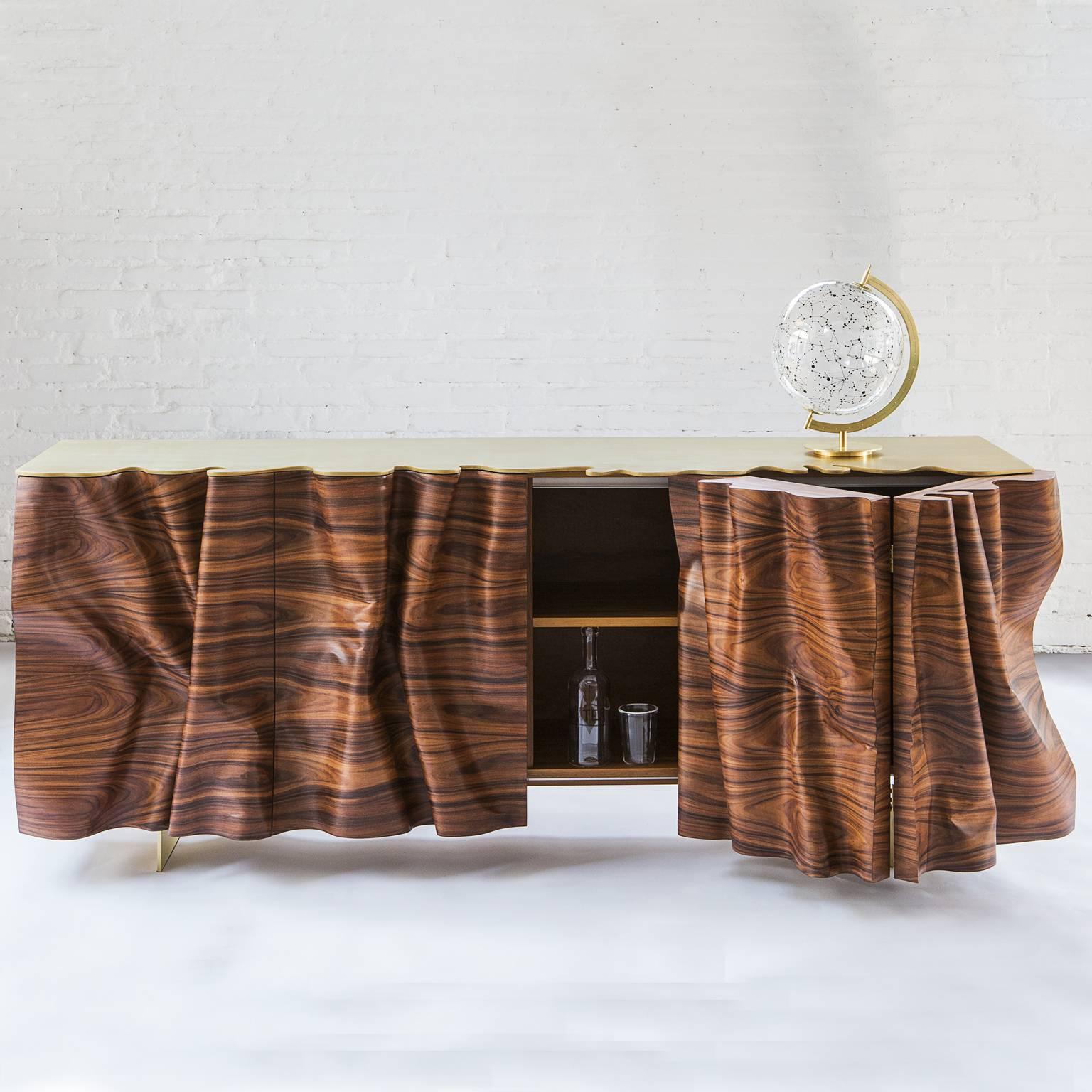 The buffet is the first item of the collection Una (Articolo Indeterminativo) by the Italian woodworker Stefano Marolla.
The title refers to the indeterminate article in the Italian grammar, as these pieces trick the eye playing on the ambiguity of