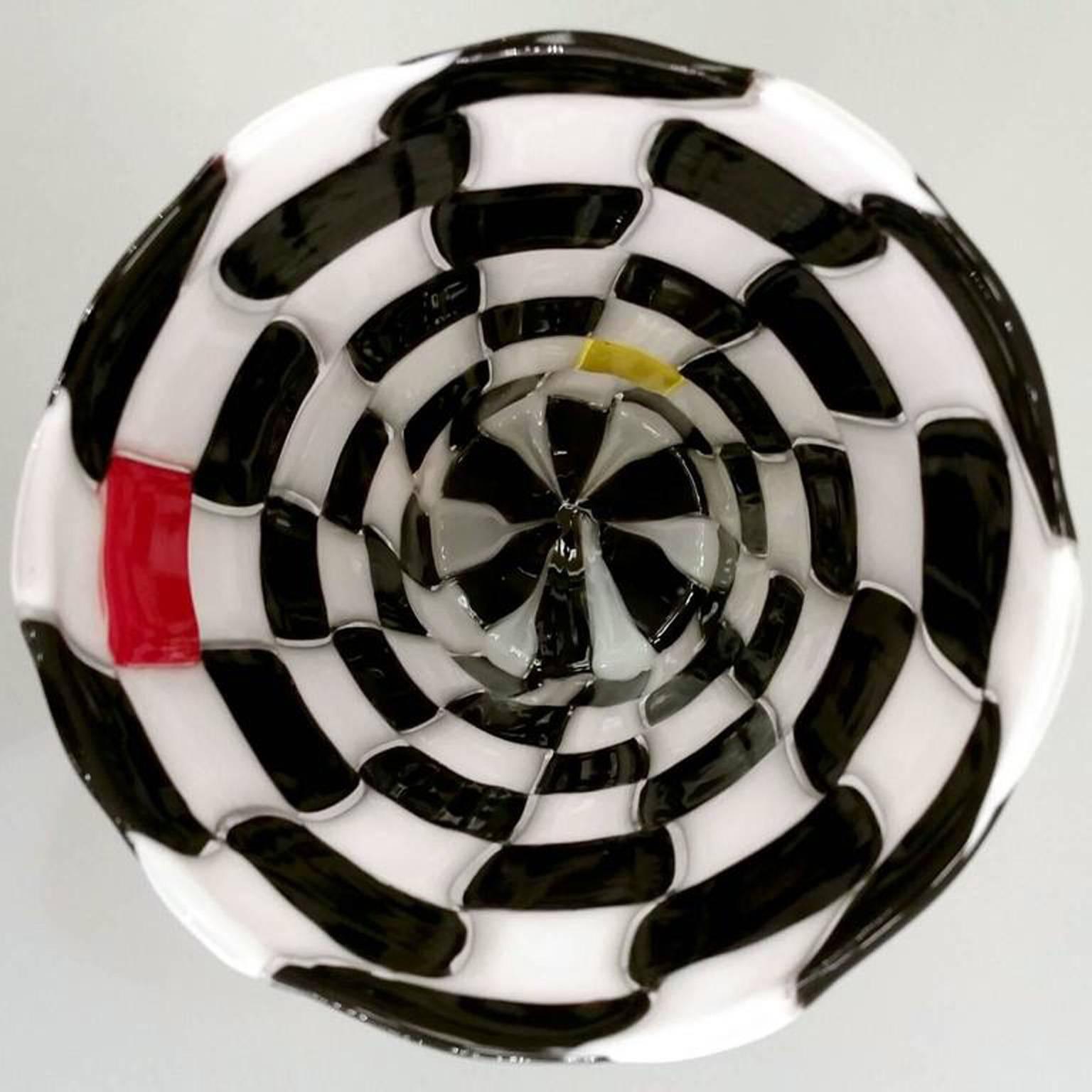 Venini Pezzati glass vase, designed by Gianni Versace. Checkerboard patchwork glass composed of black, white, red and yellow squares. Engraved signature 