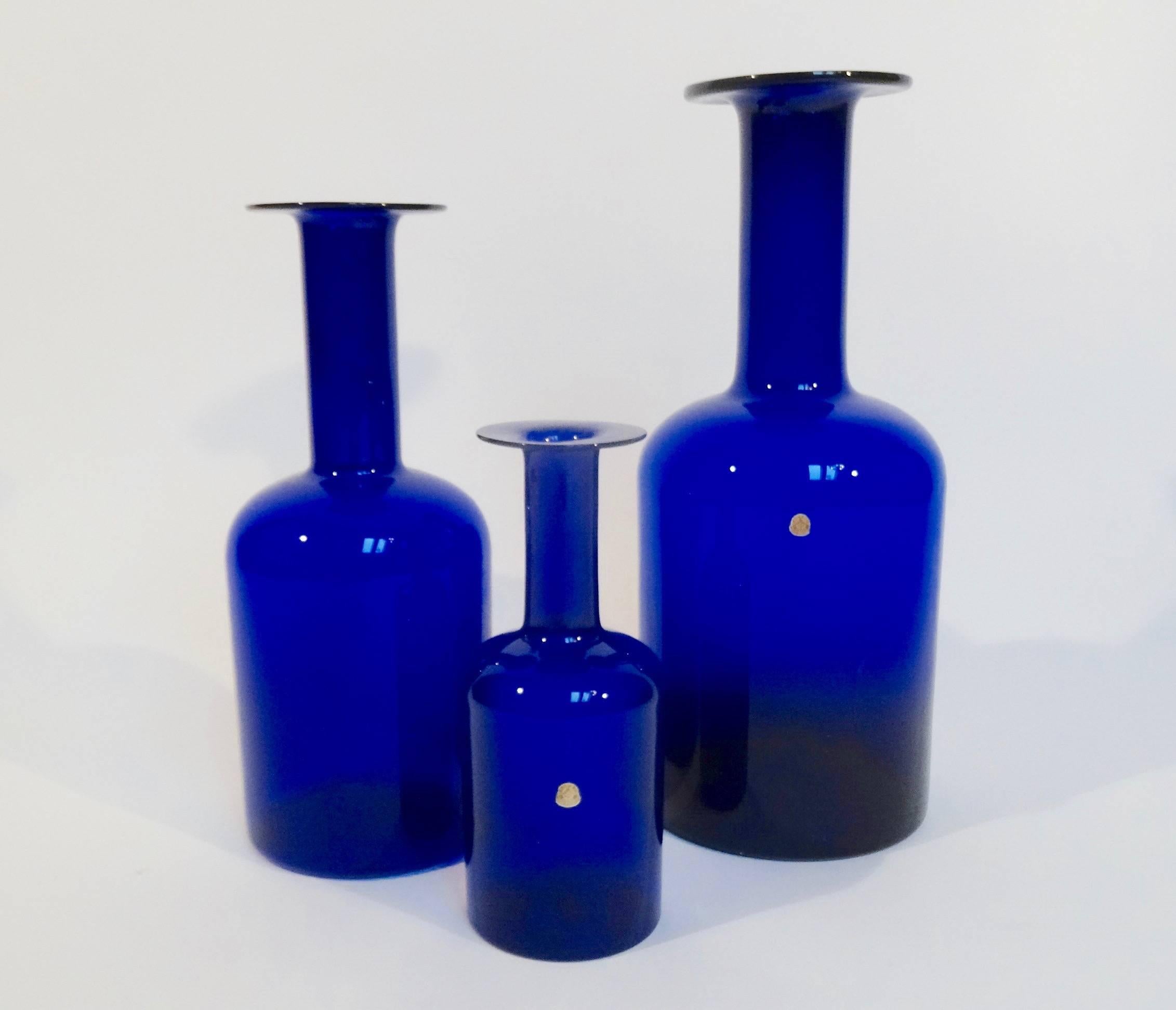 Set of three original floor vases (gulvvase) from Kastrup glasverk in 1959. They were designed by master glass blower Otto Brauer and the first vases were made in cobalt blue, green and brown. Sizes from 30 x 43 x 51 centimetres.