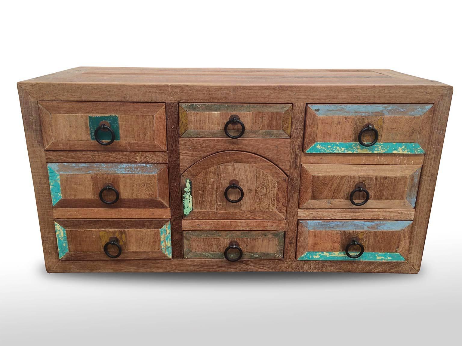 Mezquite Bargueño/chest with nine different size drawers, natural waxed honey finish with original colors (green, blue white turquoise) from antique reclaimed doors. Hand-forged iron hardware built and designed by Esteban Chapital in Mexico.
This