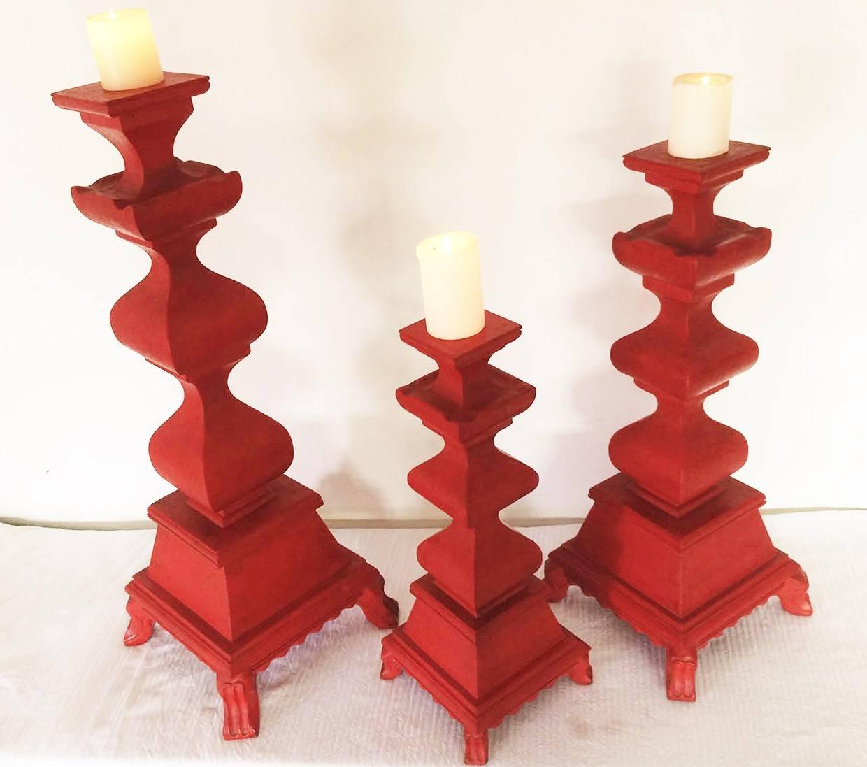 These set of three hand-carved wood candleholders are a replica of a neoclassic style blandones and have been painted with a beautiful bright red color to give them a contemporary look.
They could be used as candleholders or could be turned in to