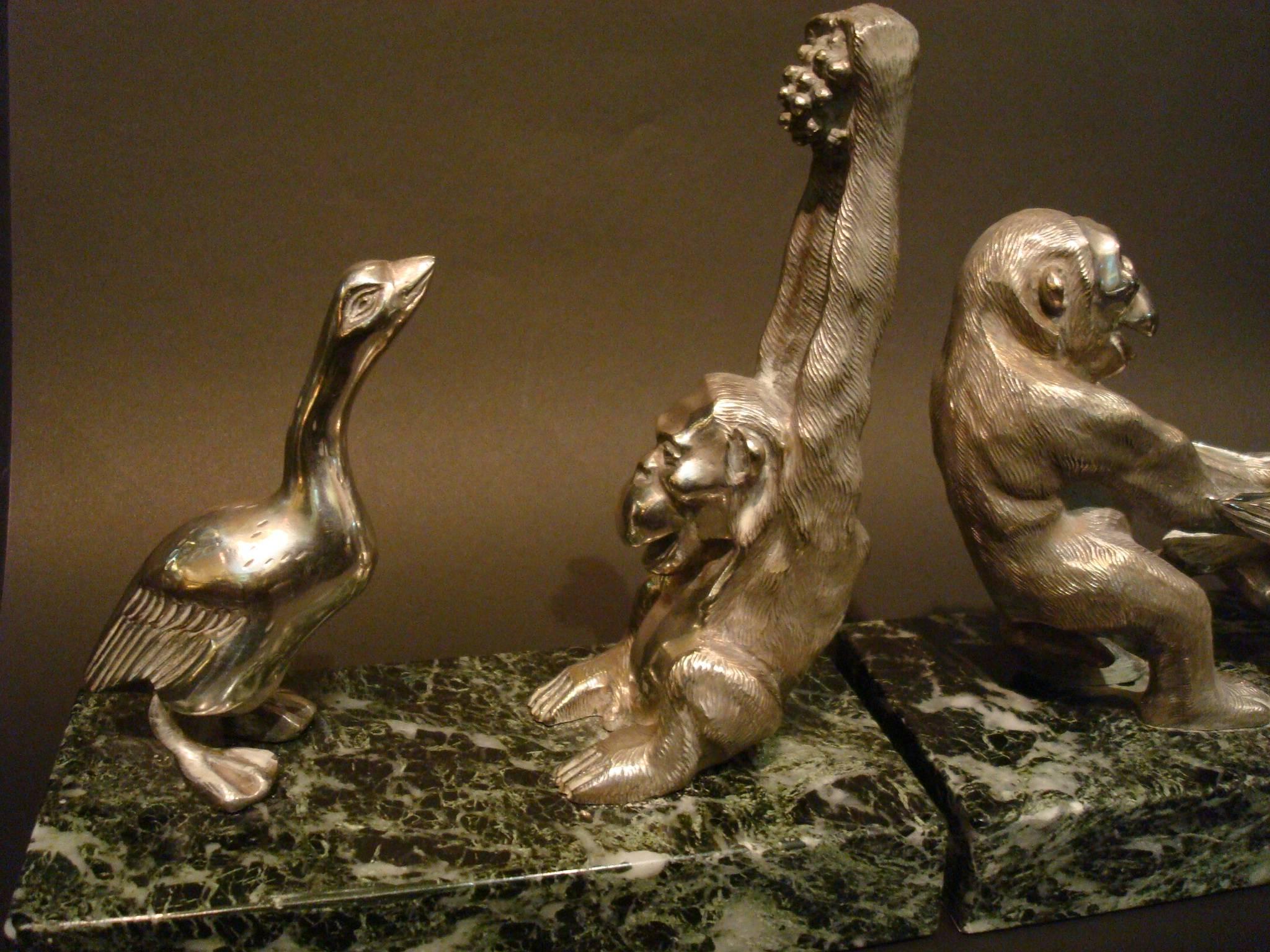Art Deco silvered bronze monkey and goose bookends by Becquerel.
A pair of Art Deco silvered bronze monkey and goose bookends by Becquerel,
circa 1930. Each with a monkey teasing a goose, on a marble base, stamped 'Becquerel, France'.
Similar