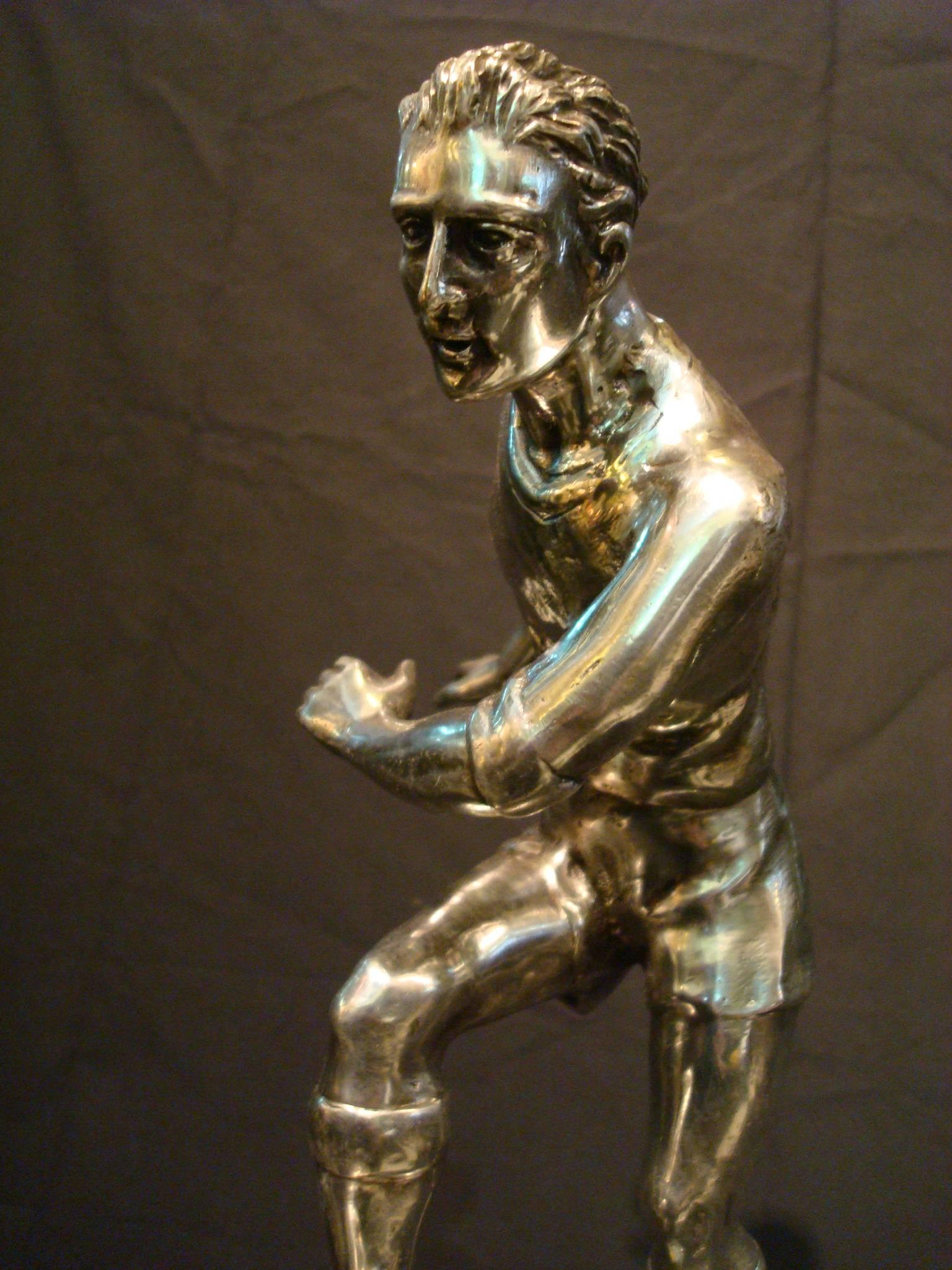 soccer player bronze statue