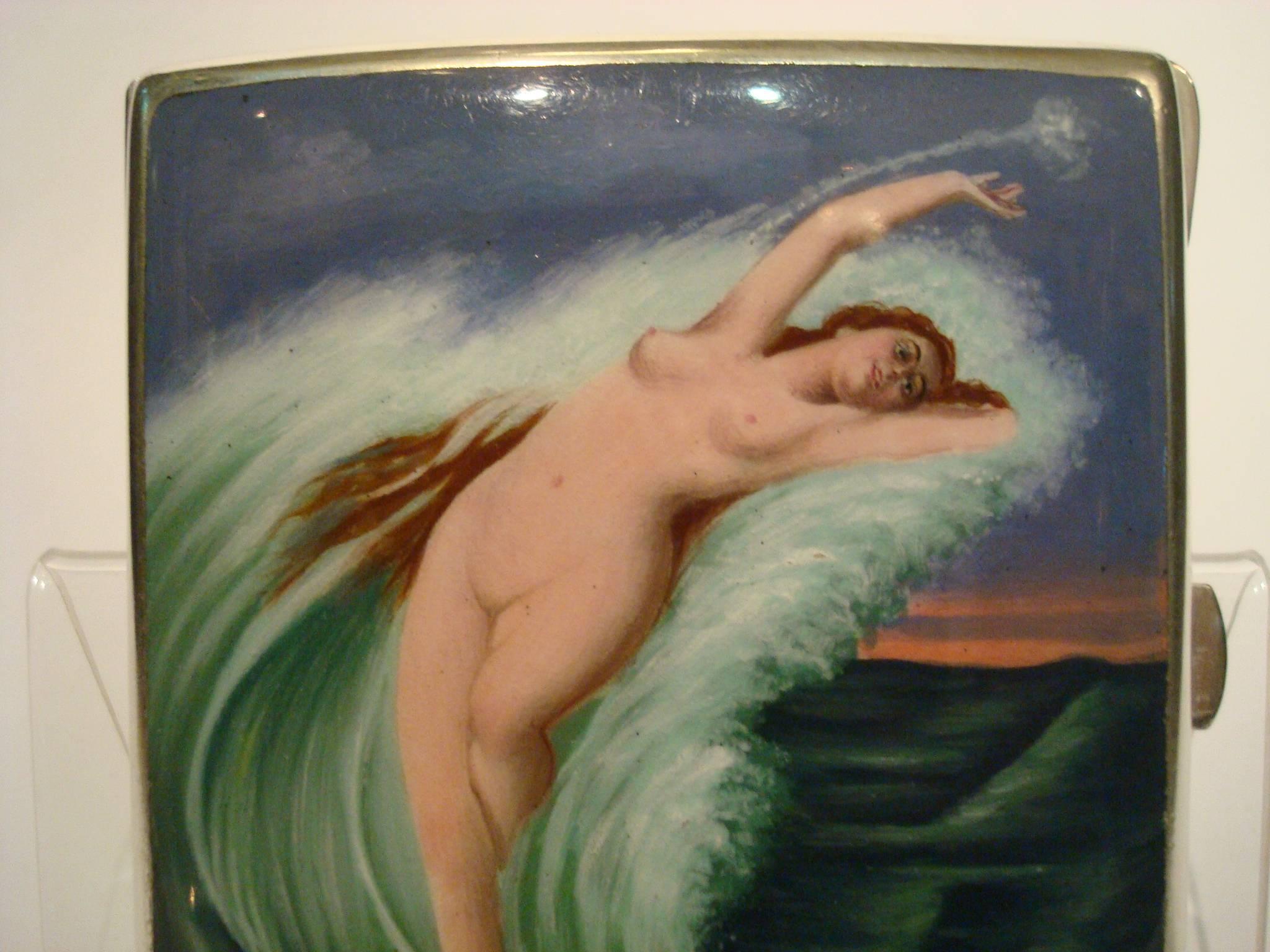 Erotic silver and enamel nude woman, mermaid cigarette case box.

European superb original antique solid silver cigarette case. Marked 800. Lovely scene of a nude lady in a sea wave. Measures 8 cm by 8.9 cm.

The enamel is in good condition, no