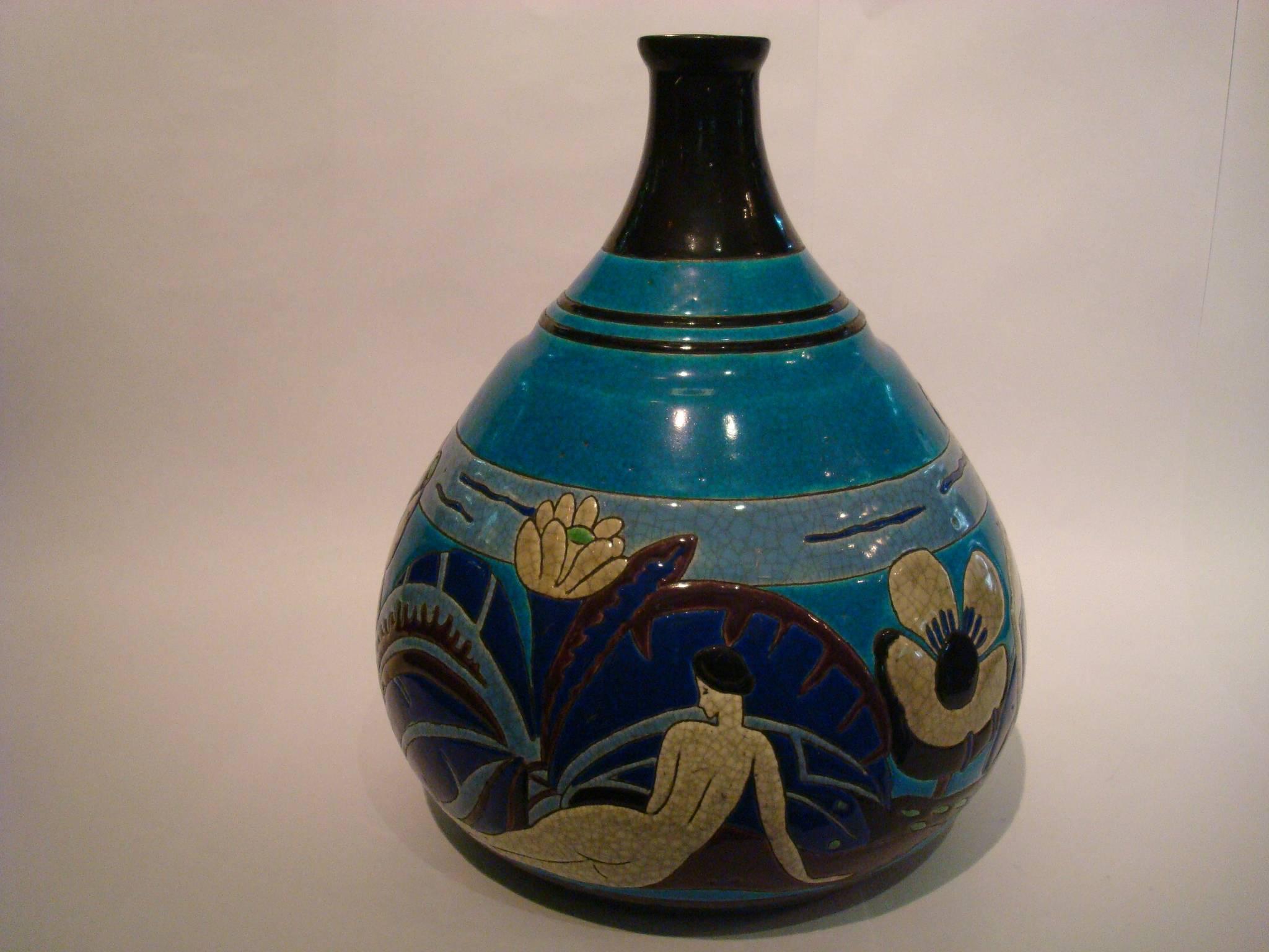 Atelier primavera longwy Baigneuses Faience Art Deco vase, French, circa 1930.
A Longwy pottery vase. Manufactured for Primavera, decorated in craquelure glazes with female bathers, nudes in garden on crackled blue ground. Earthenware, ceramic with
