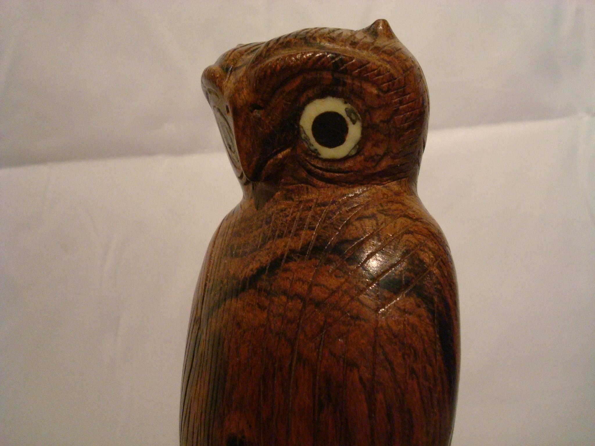 Lovely Folk Art wooden carved standing owl. It has bone around the eyes. Small chip on the base.