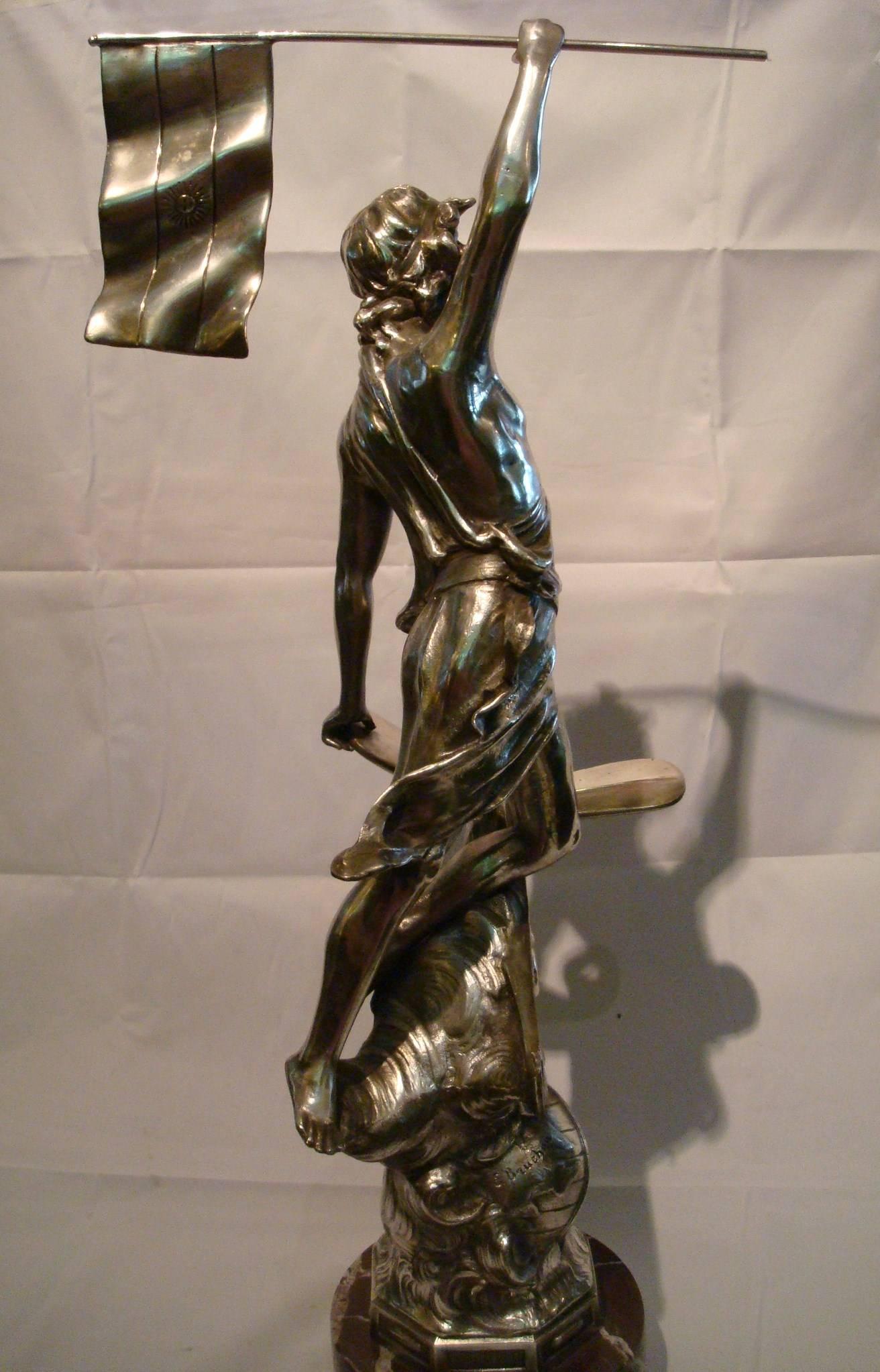 Very nice Art Nouveau aviation silvered sculpture trophy. The figure is standing over the World. Signed E. Bruchon. Perfect for any airplane fan.