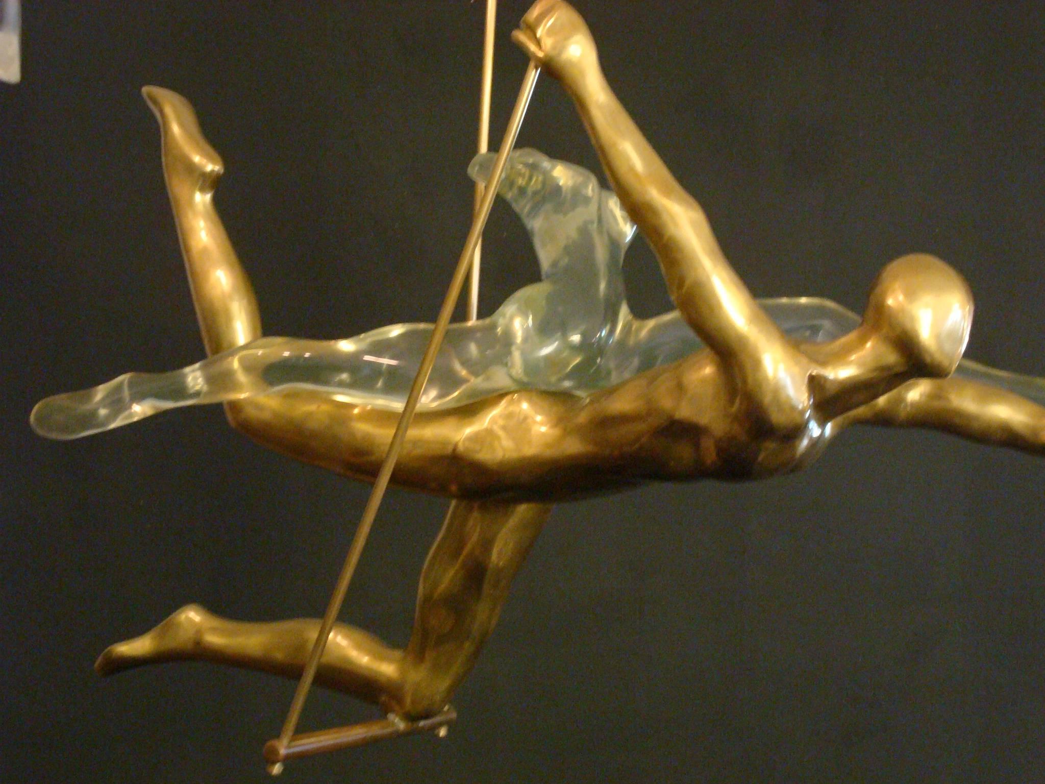 Sexy Couple on a trapeze. Made of Bronze and acrylic. Nude figures hanging from the ceiling.
        