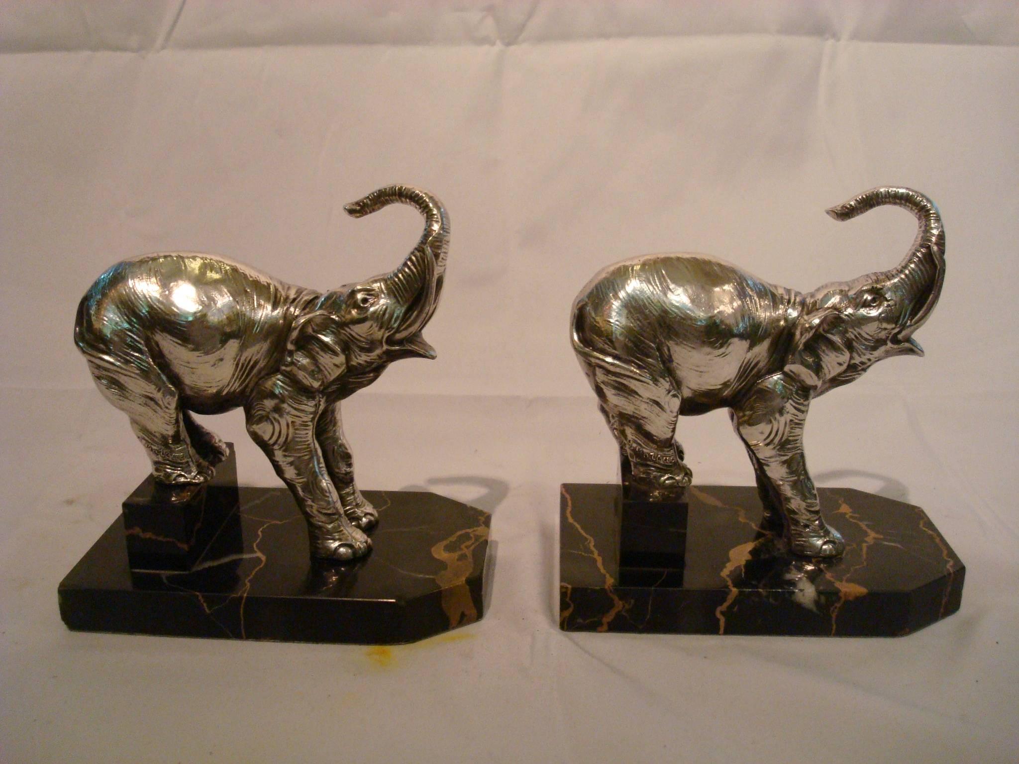 Very nice Art Deco french bookends. Elephant Sculptures mounted over Italian marble.
Silverplated figures. Signed H. Moreau.