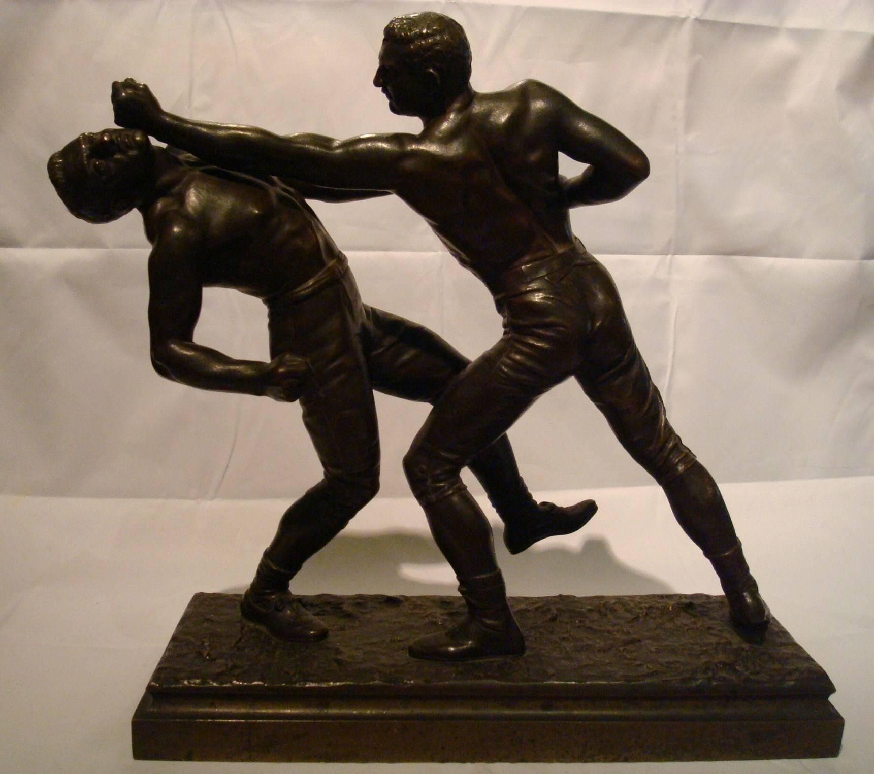 19th century French bronze pugilist boxers sculpture by Emile Hebert
Box bronze sculpture depicting two active bare-fisted, shirtless men boxing upon a naturalistic rectangular base. Signed 
