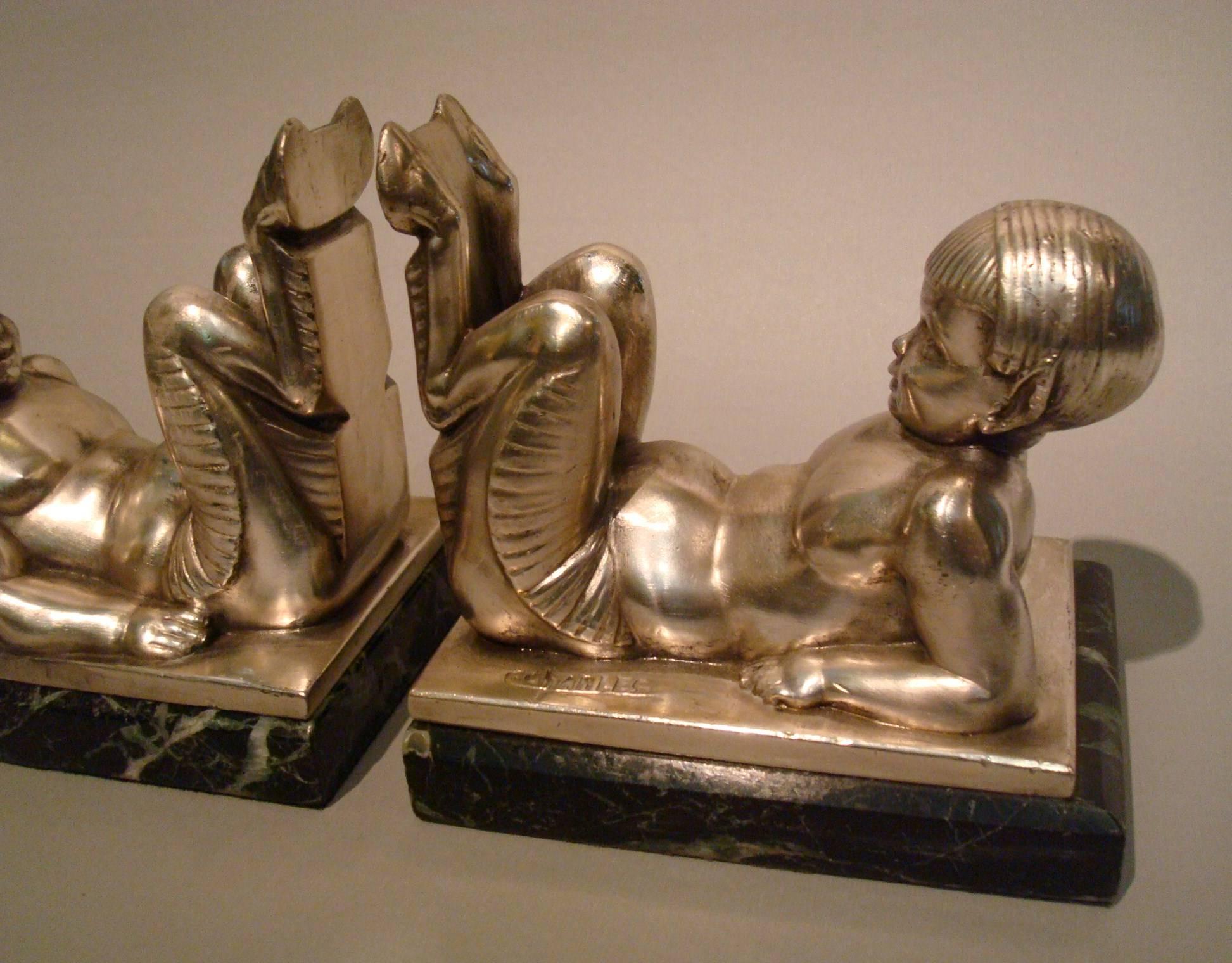 French Art Deco bookends Young Satyrs by C. Charles on marble base, 1930
Lovely pair of Art Deco bookends with lying young satyrs by the French artist C. Charles. These wonderful, playful silver plated spelter satyr bookends were made by the Le