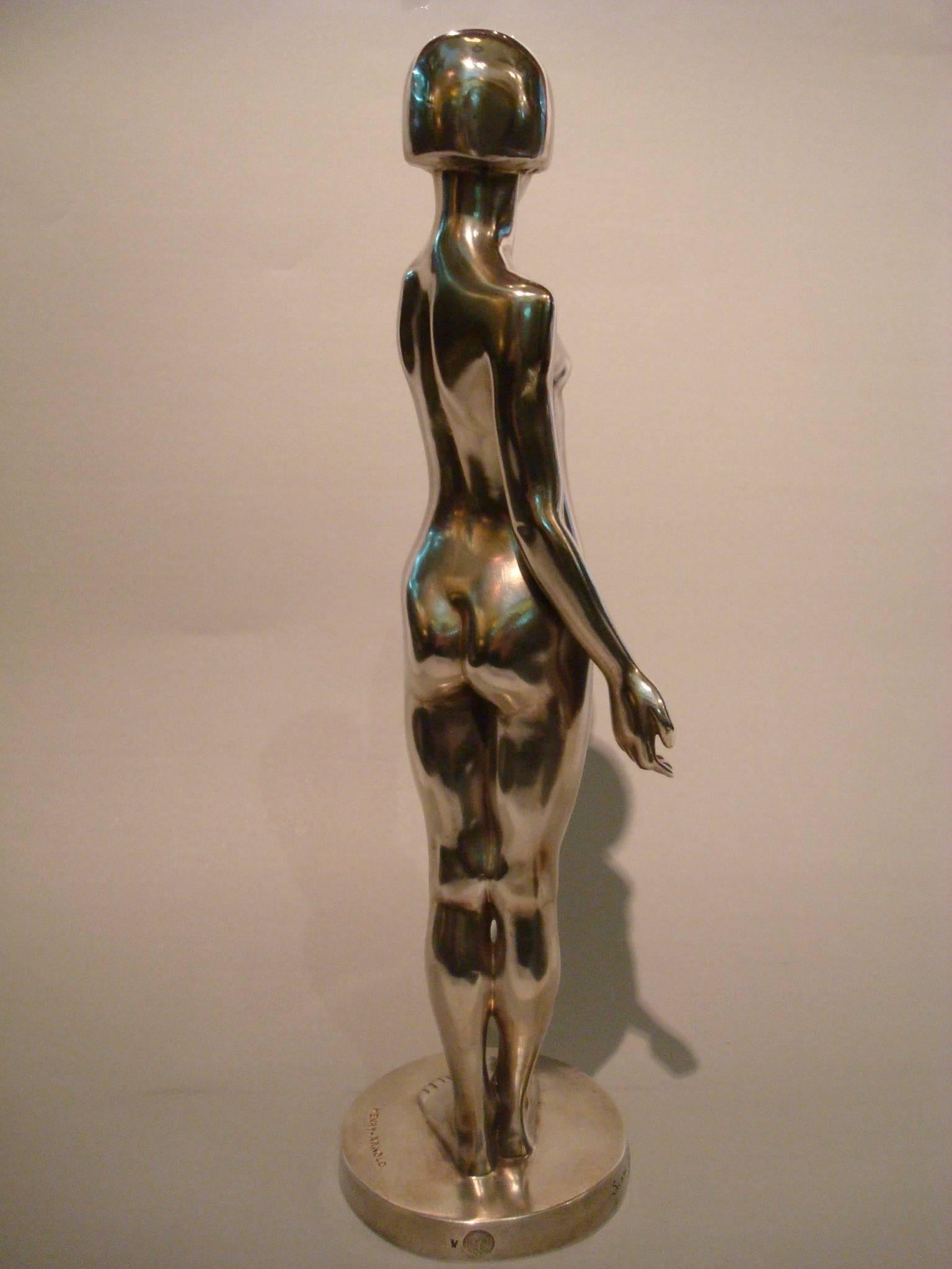 Very fine Art Deco silvered bronze sculpture of a standing nude, young girl holding a dove. This bronze was presented at the “Salon d’ automne” in 1928 and bought by the French government. Called 