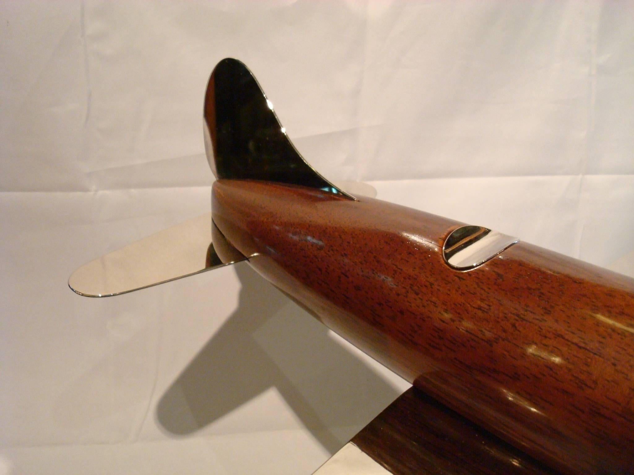Very nice large 20th century, Art Deco streamline airplane wooden desk model sculpture. Perfect for a aviation fan. Made of wooden and silvered brass. Professional restoration has been made. Excellent conditions. Fantastic details in the engine.