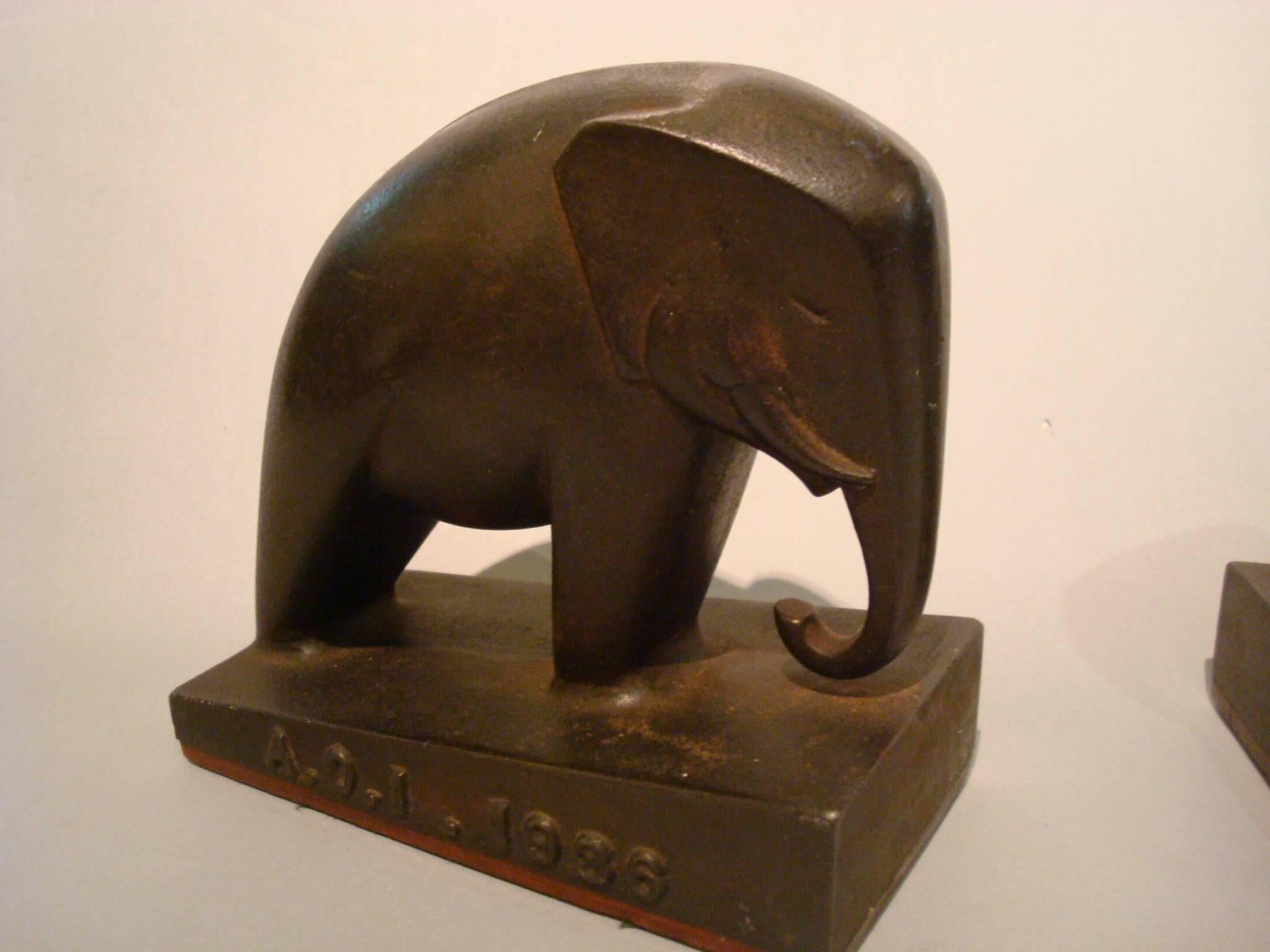 20th century Art Deco iron elephant bookends, Italy, 1936. Very nice and heavy Bookends. Marked A. O. I. 1936 - means Africa Orientale Italiana. 

Italian East Africa (Italian: Africa Orientale Italiana) was an Italian colony in the Horn of