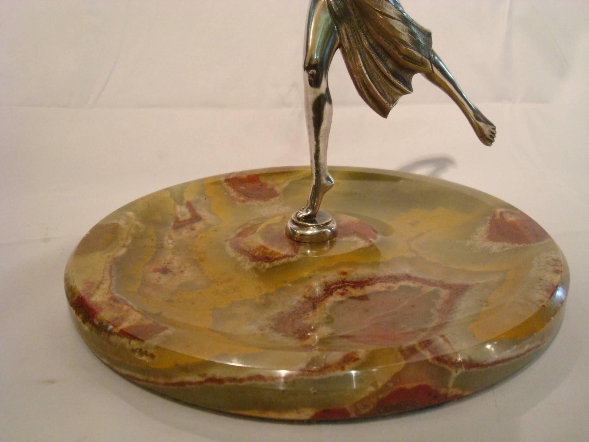 Silvered bronze sculpture of a women dancing. It has a marble tray or plated that can be use for jewelry, personal cards or keys. Made in France, 1930s.