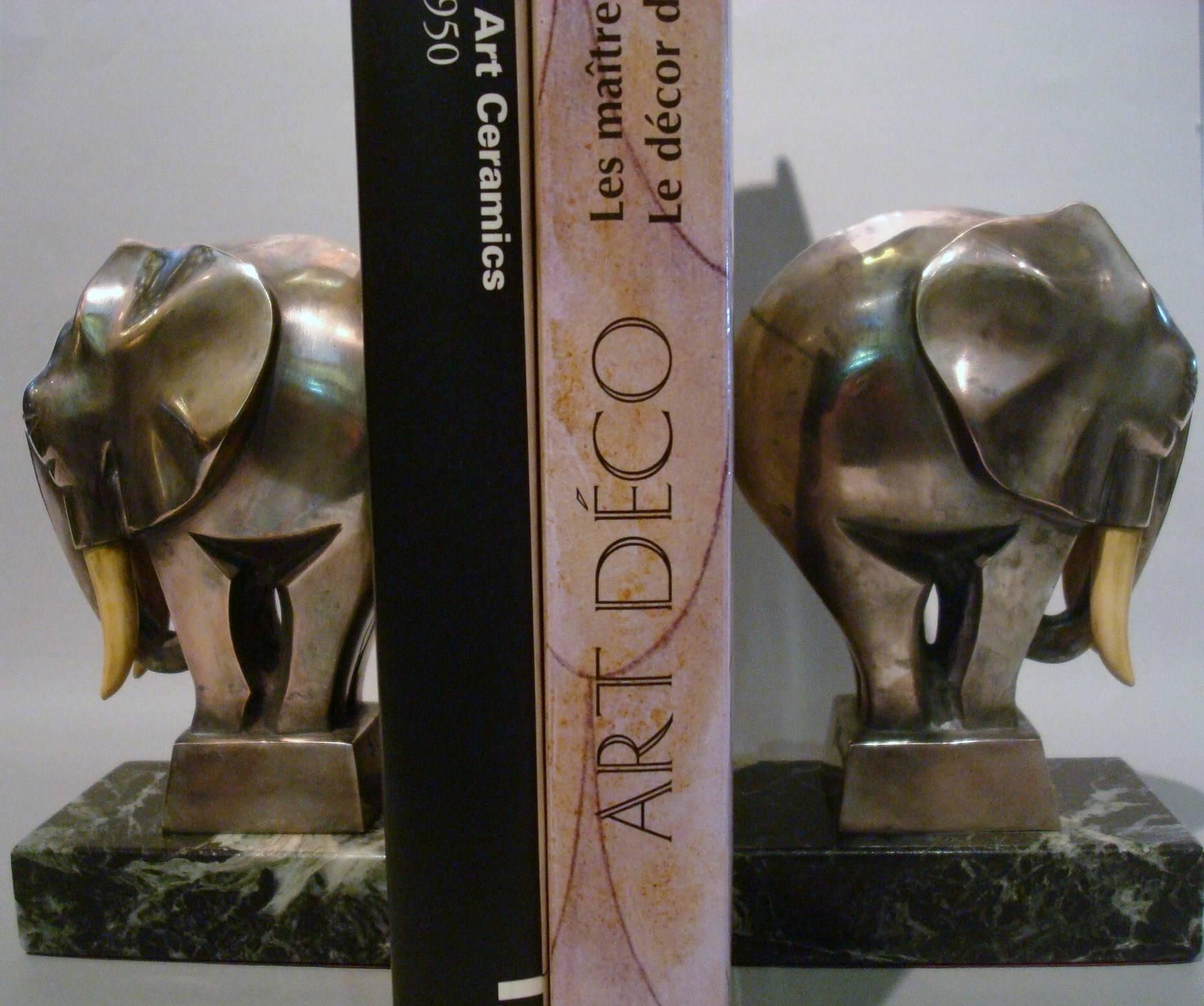 Fantastic Art Deco silvered bronze elephant bookends signed G. H. Laurent, France, 1920s. Perfect desk piece. Nice and heavy bronze bookends mounted over Italian green marble bases. Nice animal Sculpture. Some age wear on the plating.