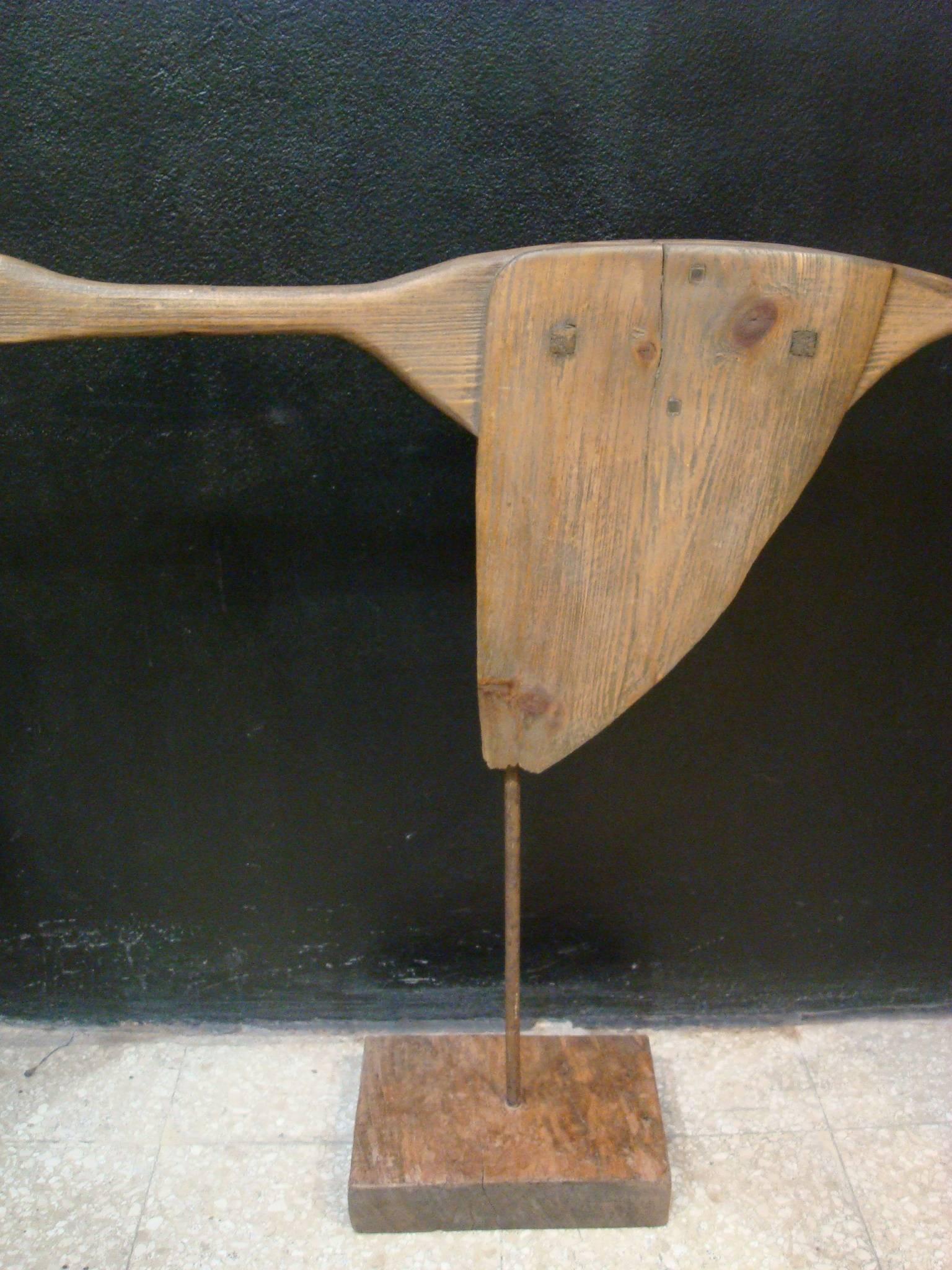 Carved wooden flying goose duck sculpture. We found a very nice wooden goose on a barn (unknown age of the goose) and made a wooden and iron stand for it. It displays very nice. The base is of heavy wood, so the goose figure stands correct. Nice