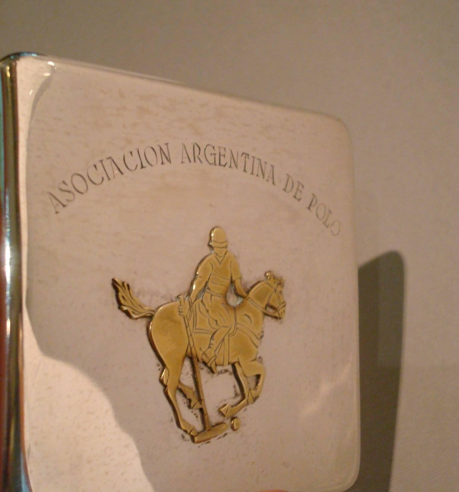 Lovely Polo scene silver cigarette case, can be used as card holder if the size is right.
English Silver. Marked Birmingham 1937-38 and marked Rowell Oxford.
Aybe it was a price given or a souvenir.