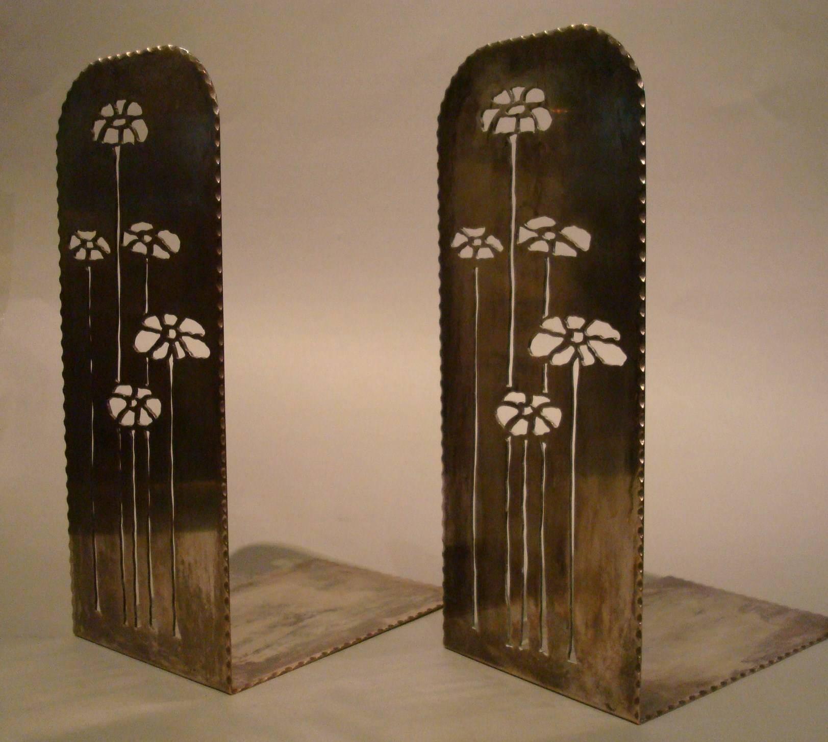 Art Nouveau pair of Newcomb College Pierced Brass Bookends
A pair of Newcomb College Pierced Brass Bookends, circa 1930, by Rosalie Roos Wiener, decorated with oxeye daisies, silvered patina, unmarked. A nearly identical pair of bookends is